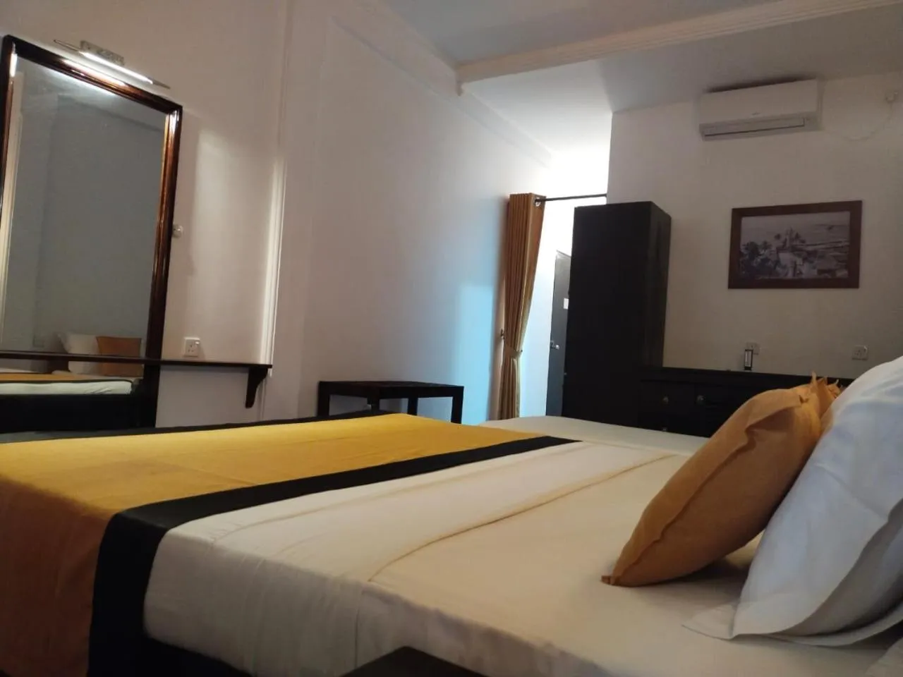 Bed in DALAWELLA BEACH RESORT