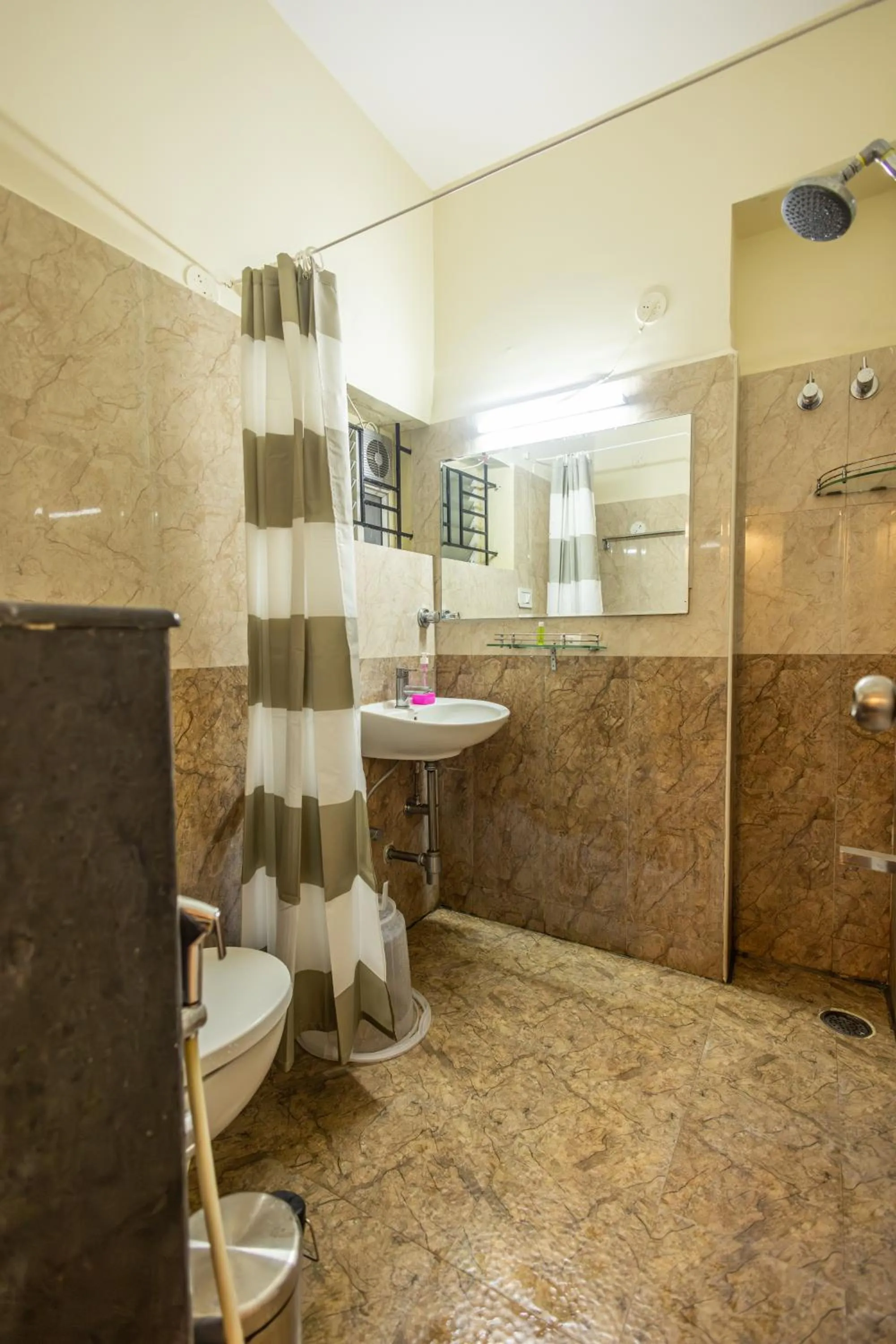 Bathroom in Suraksha Stay Brookfield Hotel
