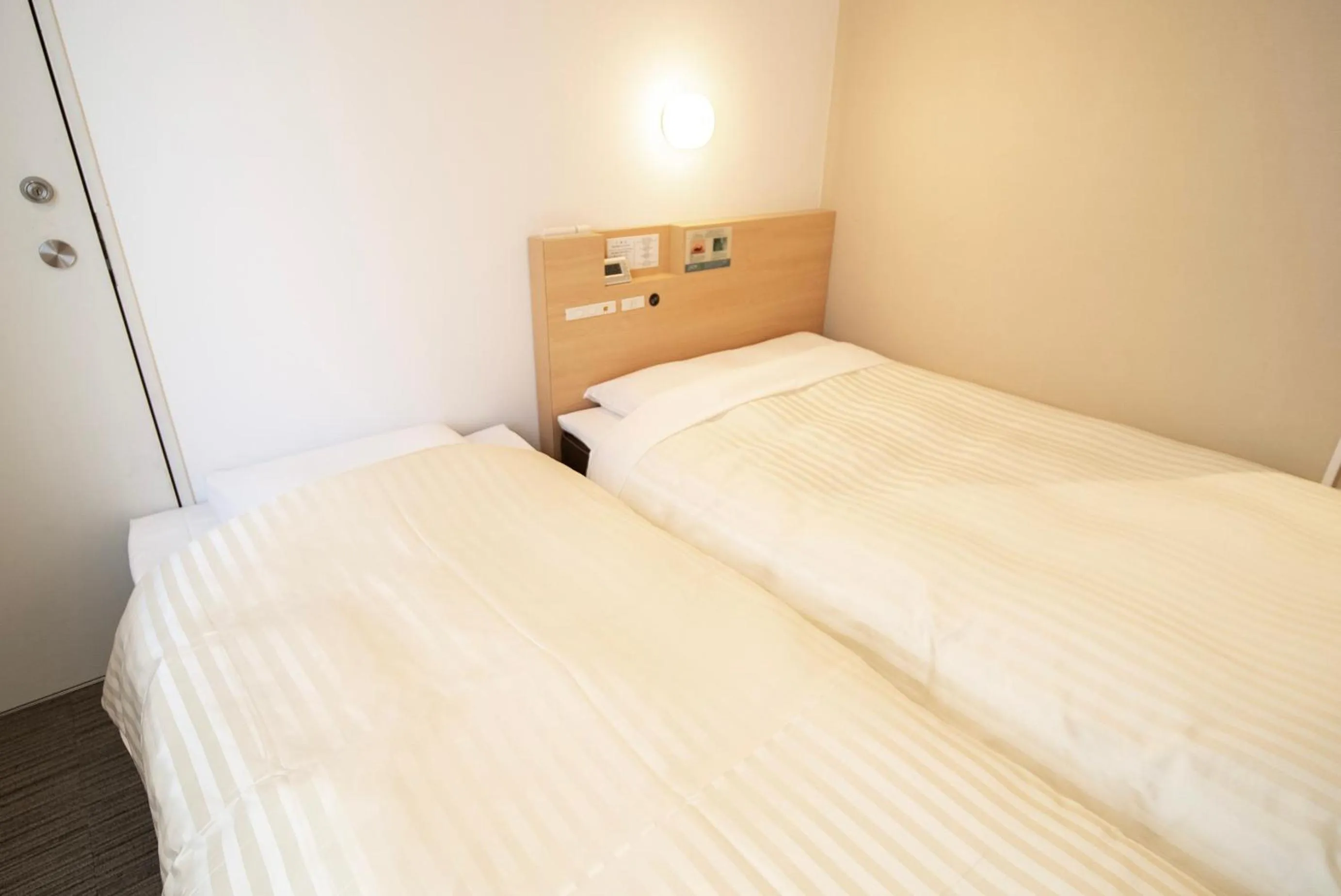 Bed in Super Hotel Asakusa