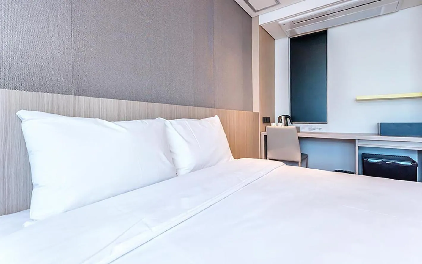 Bed in Noblepia Hotel