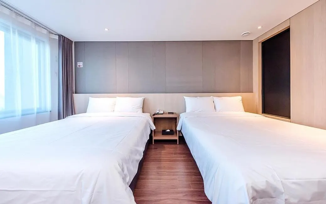 Bed in Noblepia Hotel