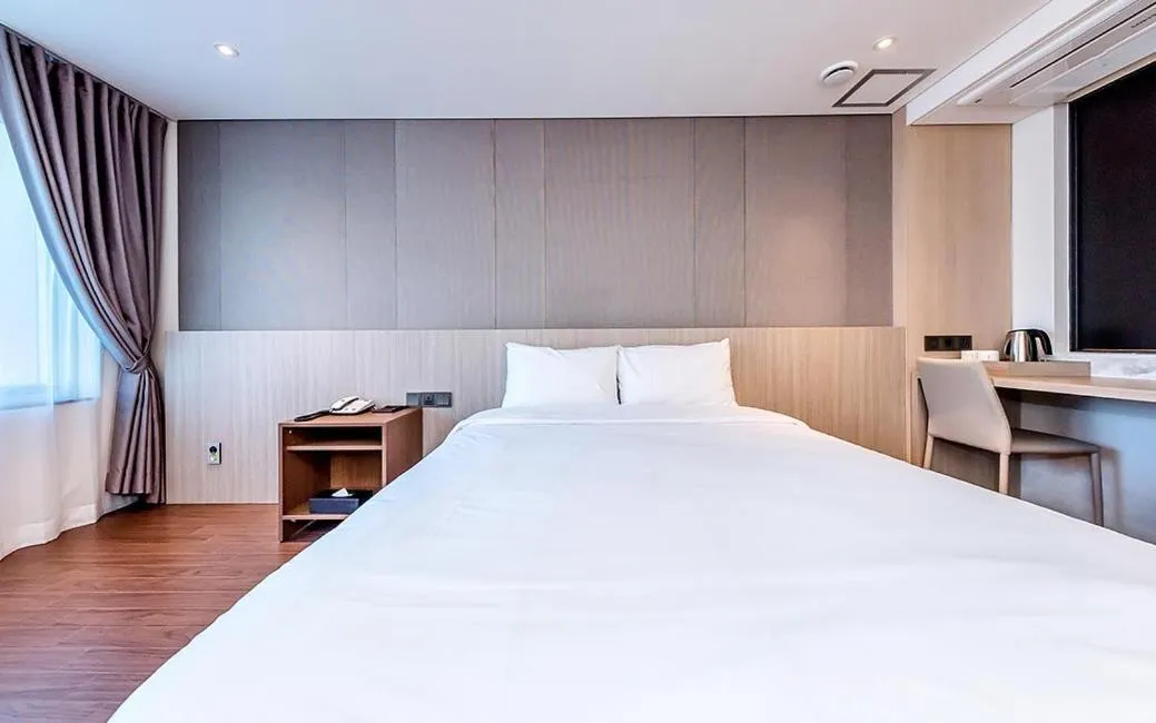 Bed in Noblepia Hotel