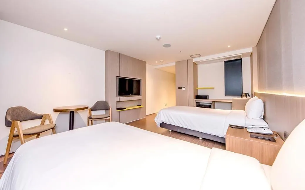 Bed in Noblepia Hotel