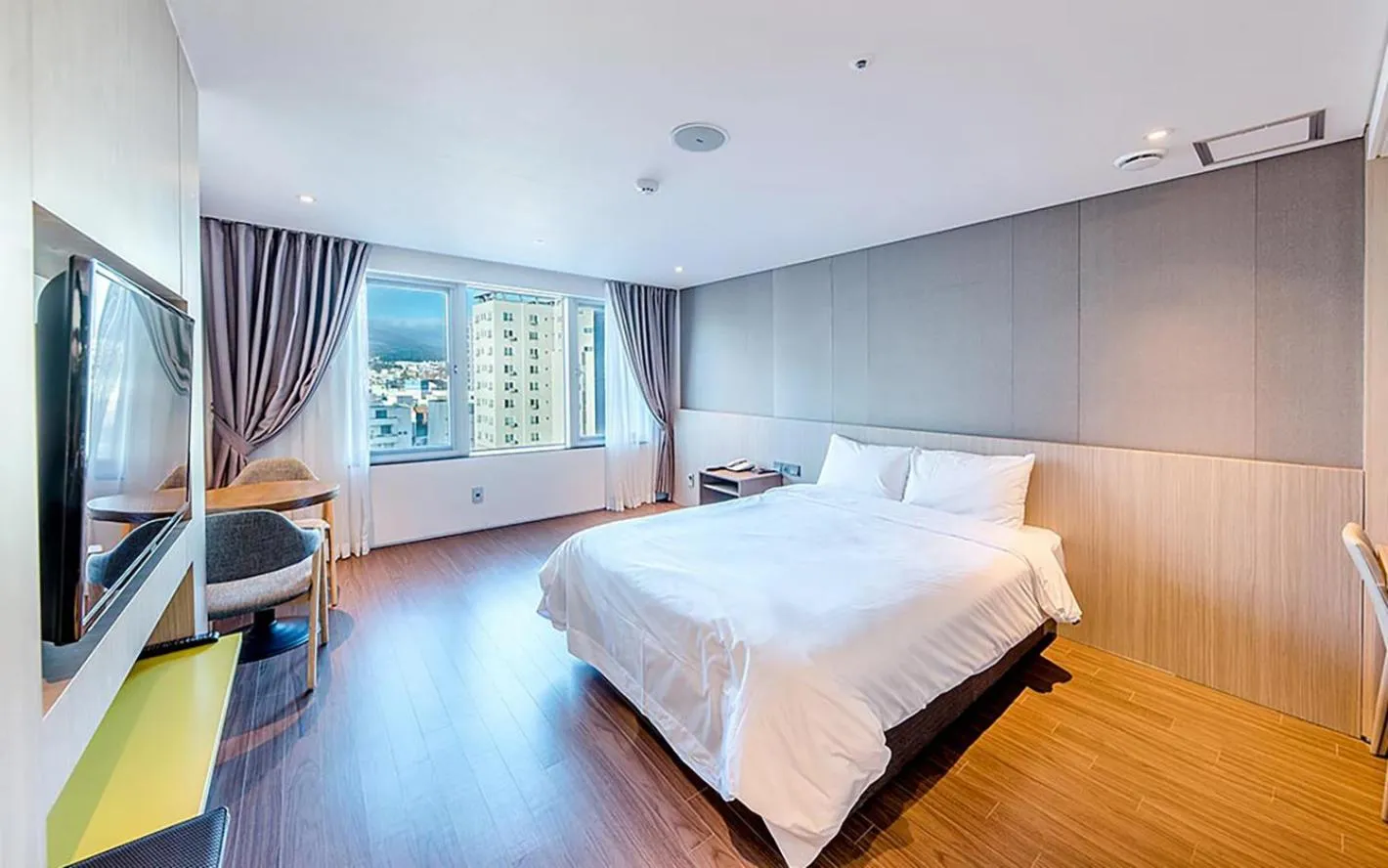 Bed in Noblepia Hotel