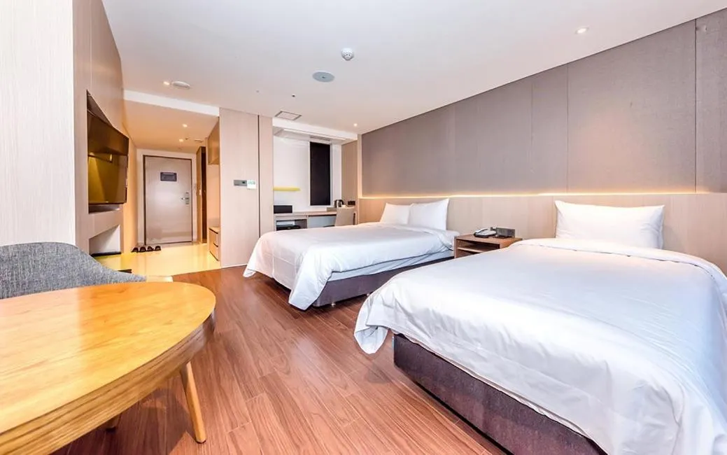 Bed in Noblepia Hotel