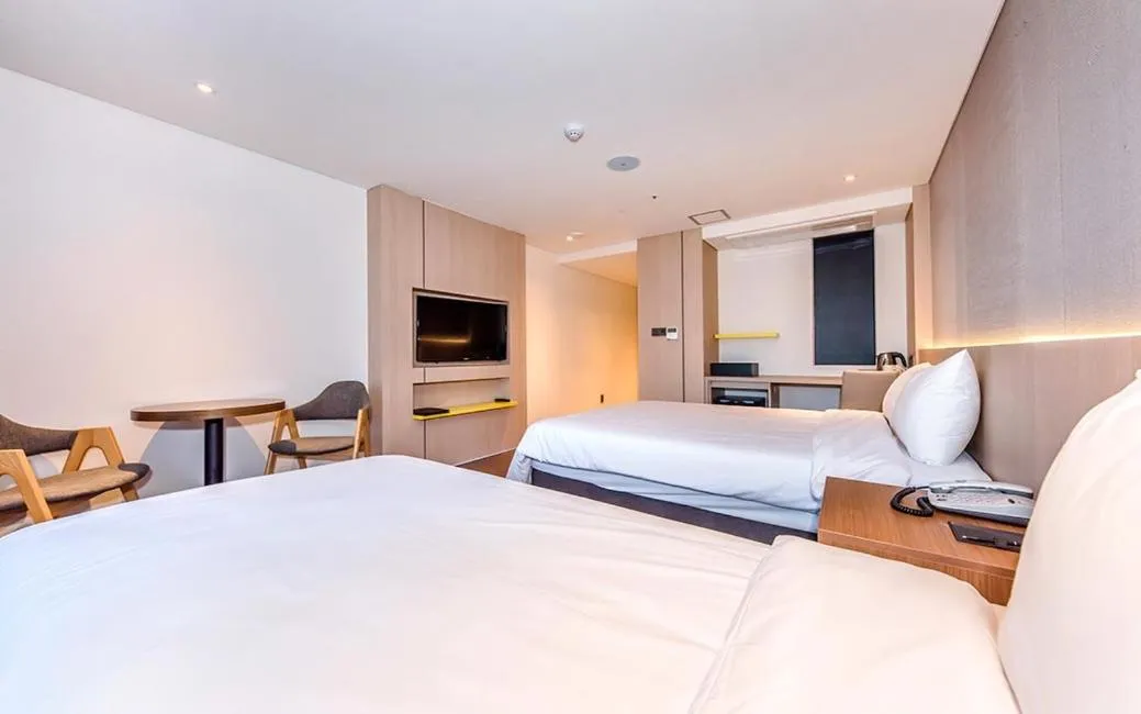 Bed in Noblepia Hotel