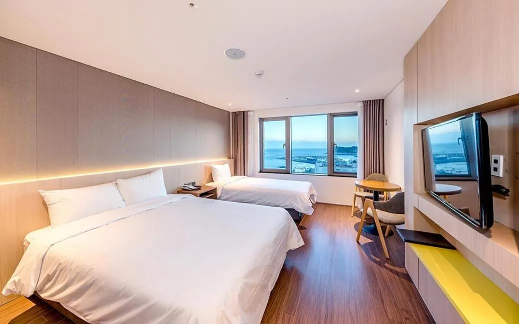 Bed in Noblepia Hotel