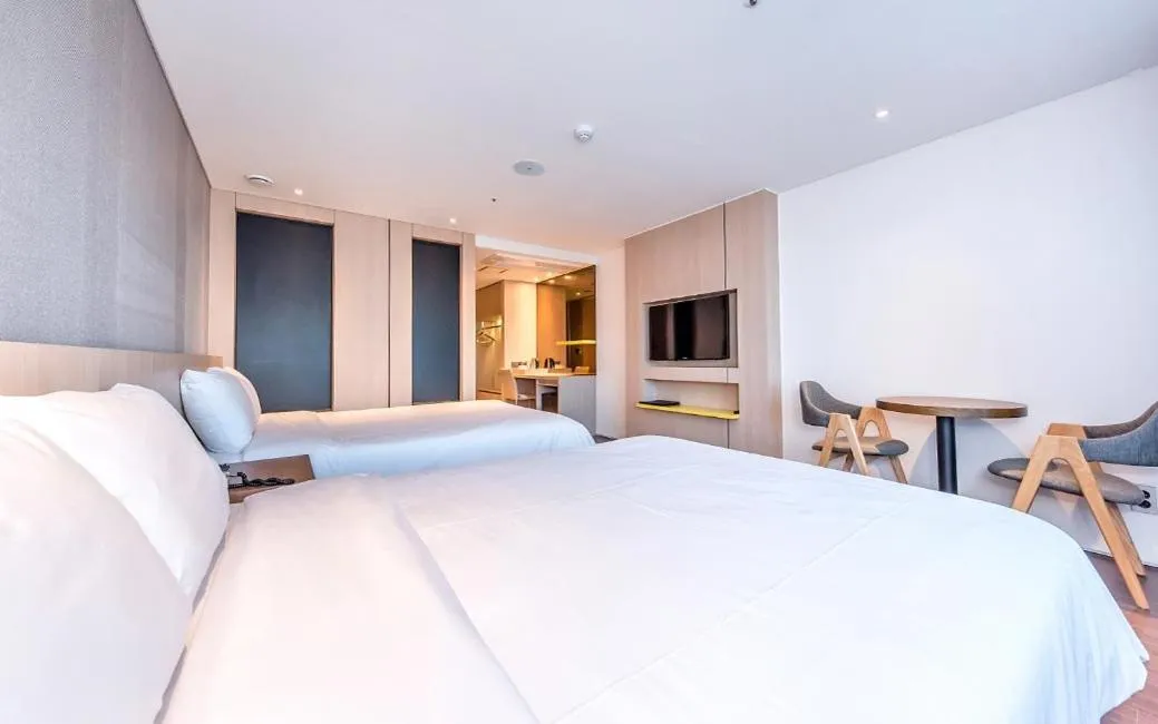 Bed in Noblepia Hotel