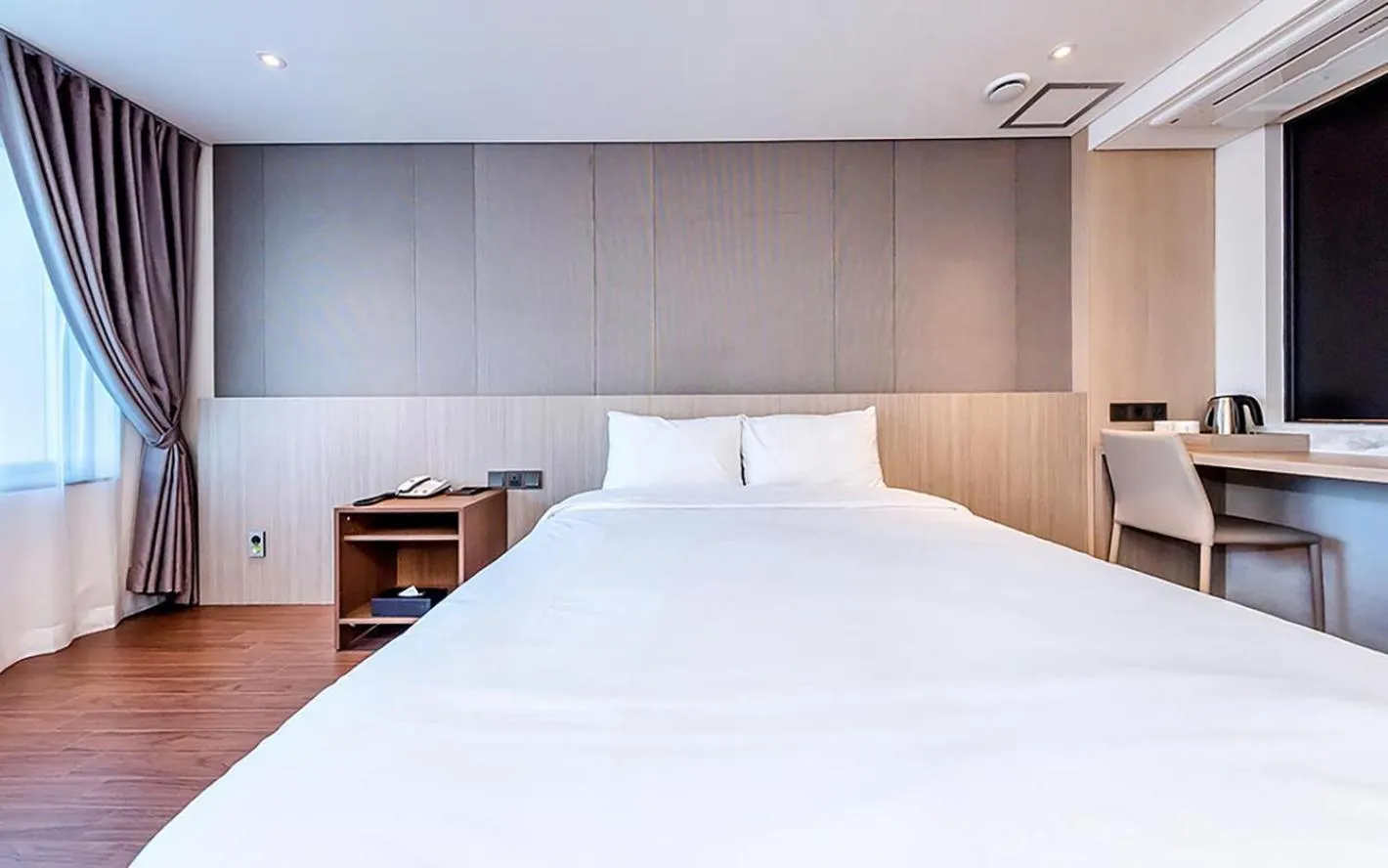 Bed in Noblepia Hotel