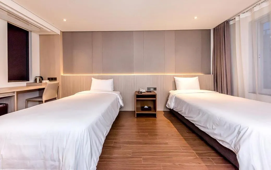 Bed in Noblepia Hotel