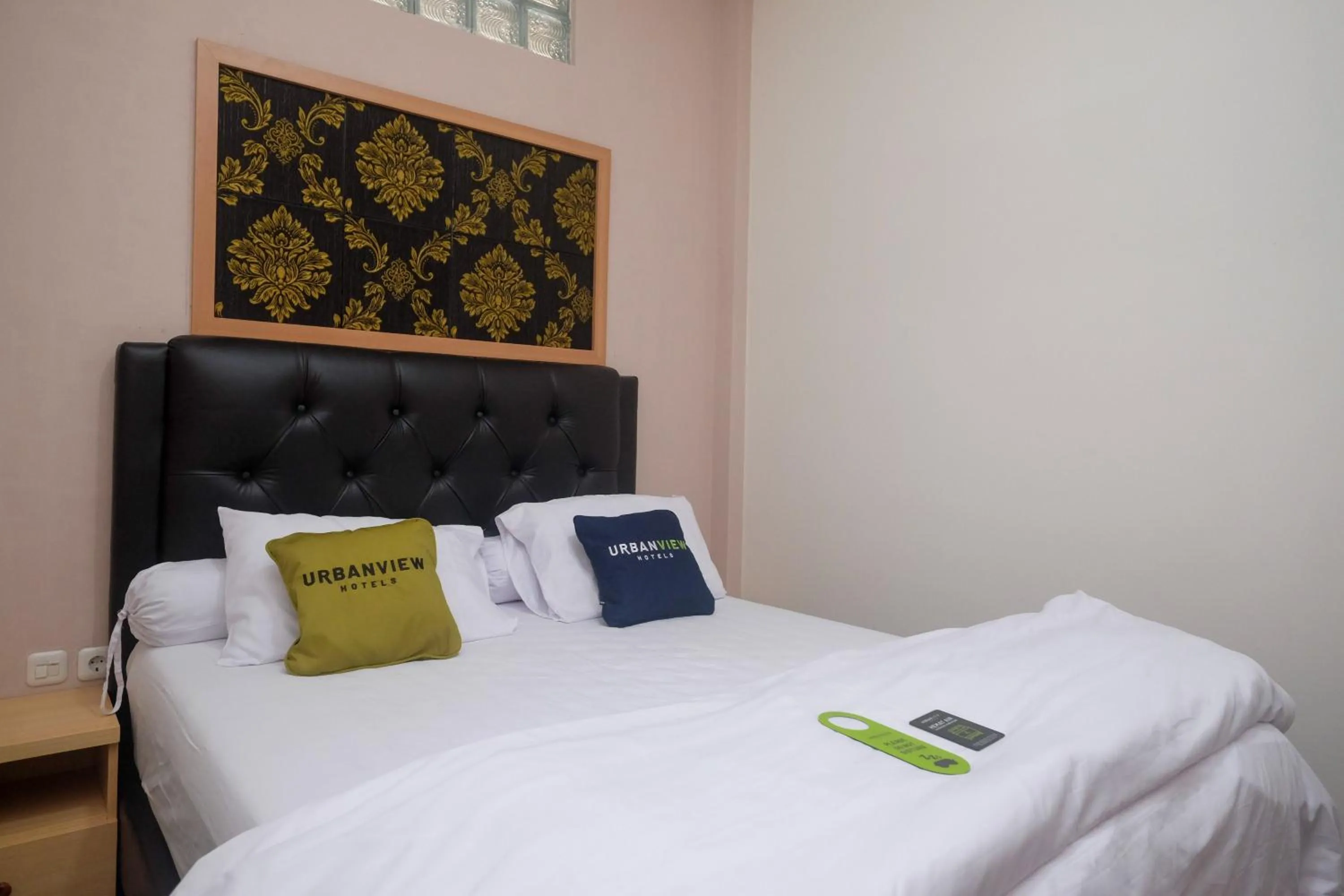 Bedroom, Bed in Urbanview Grand Lotus Hotel by RedDoorz