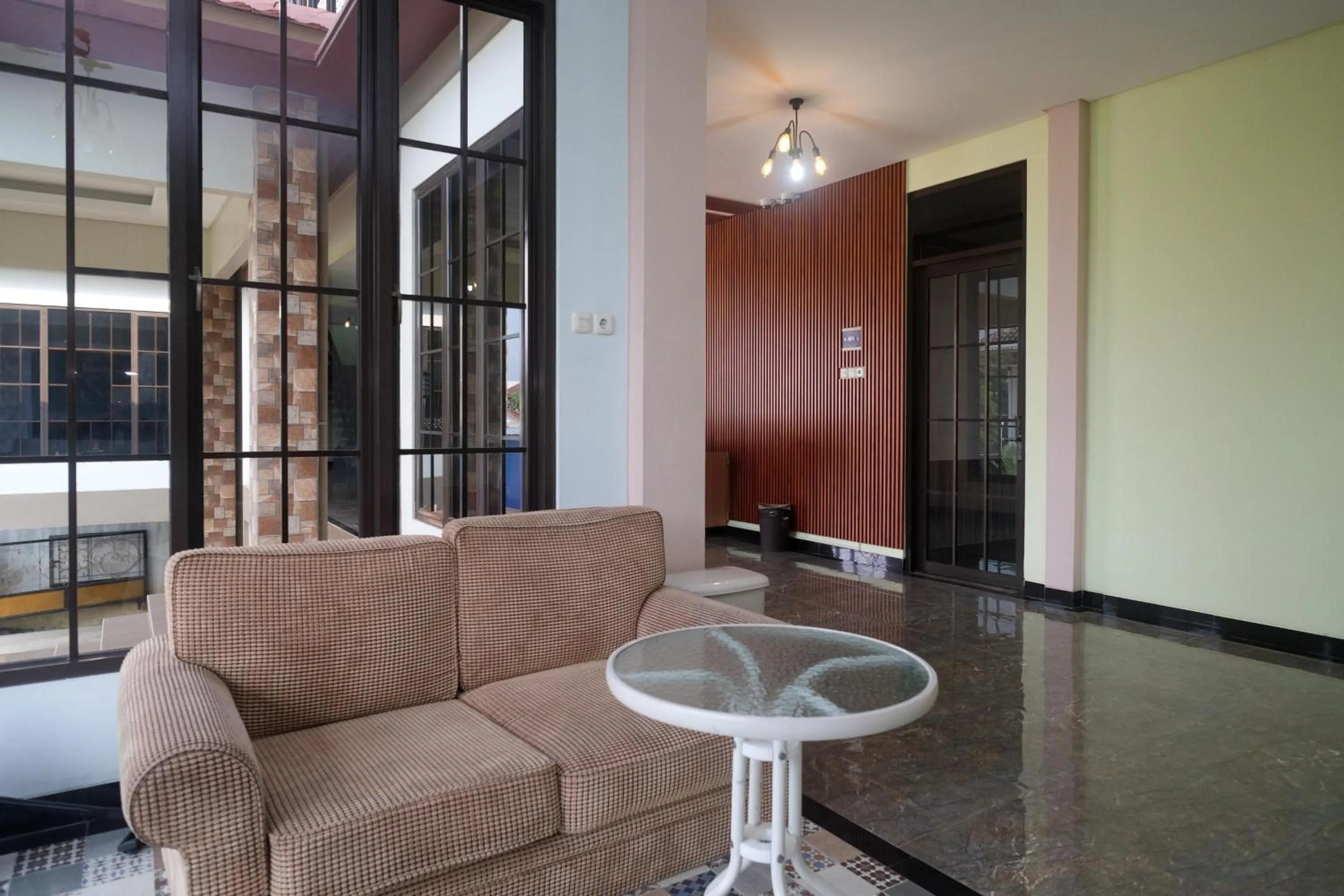 Seating area in Urbanview Grand Lotus Hotel by RedDoorz