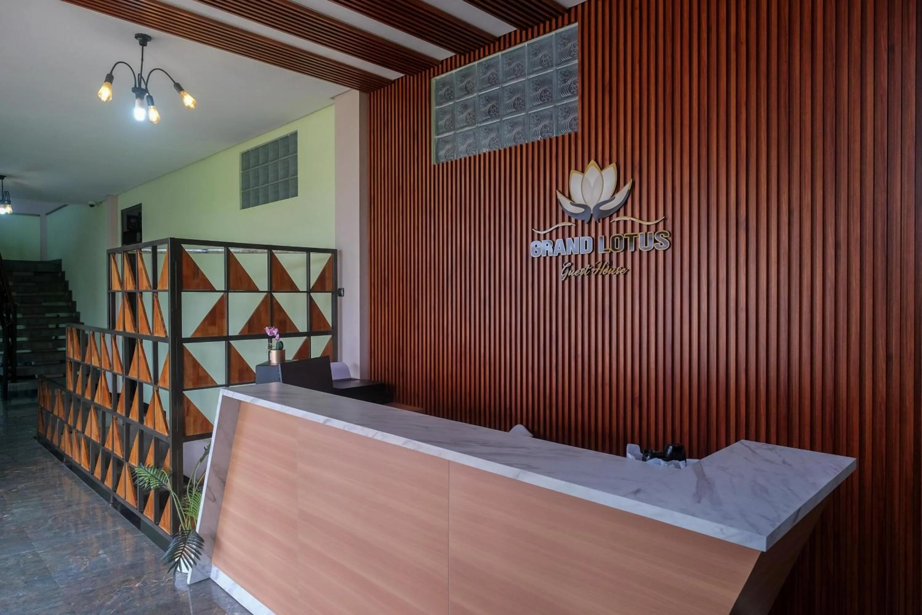 Lobby or reception in Urbanview Grand Lotus Hotel by RedDoorz