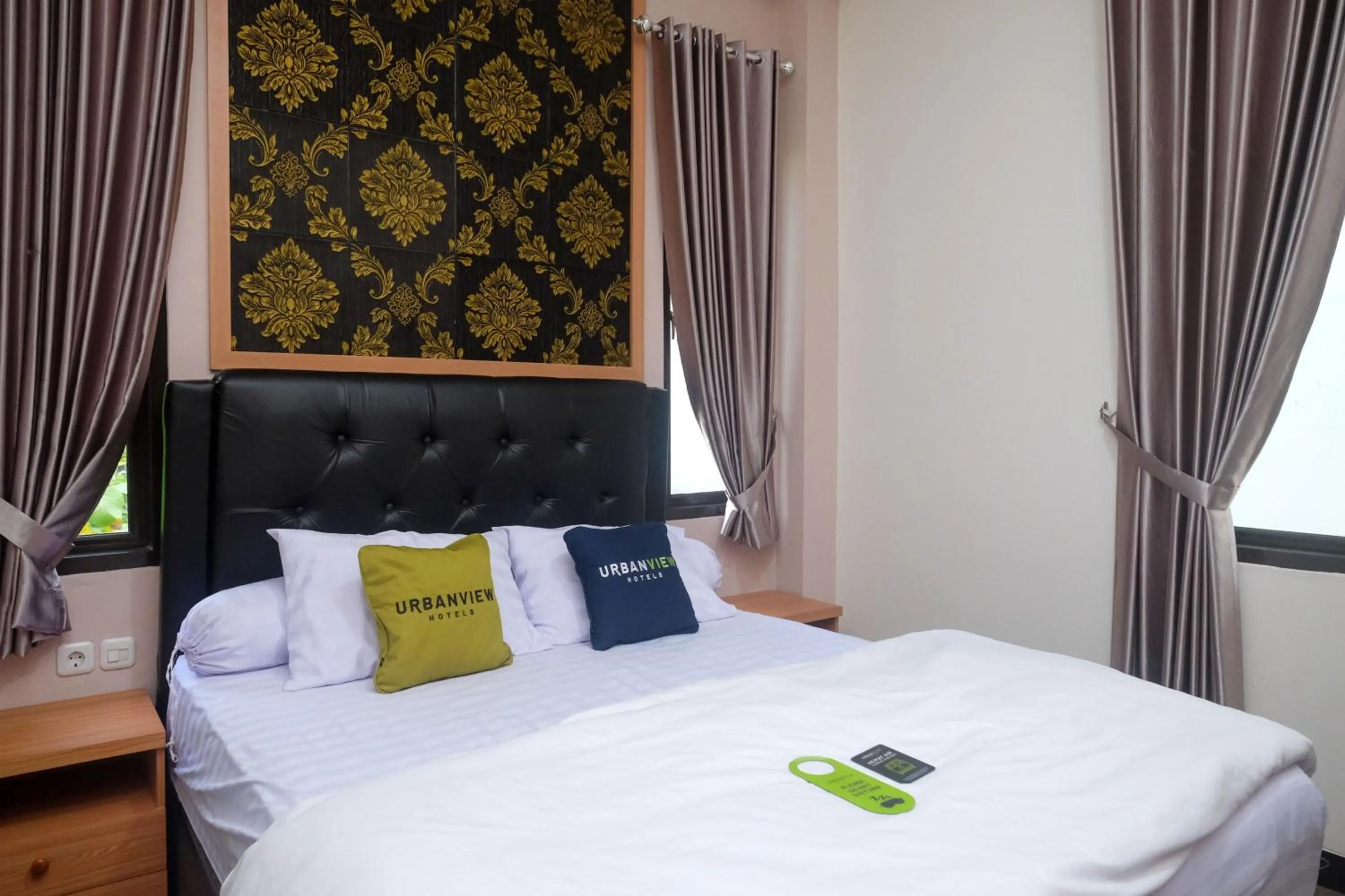 Bedroom, Bed in Urbanview Grand Lotus Hotel by RedDoorz