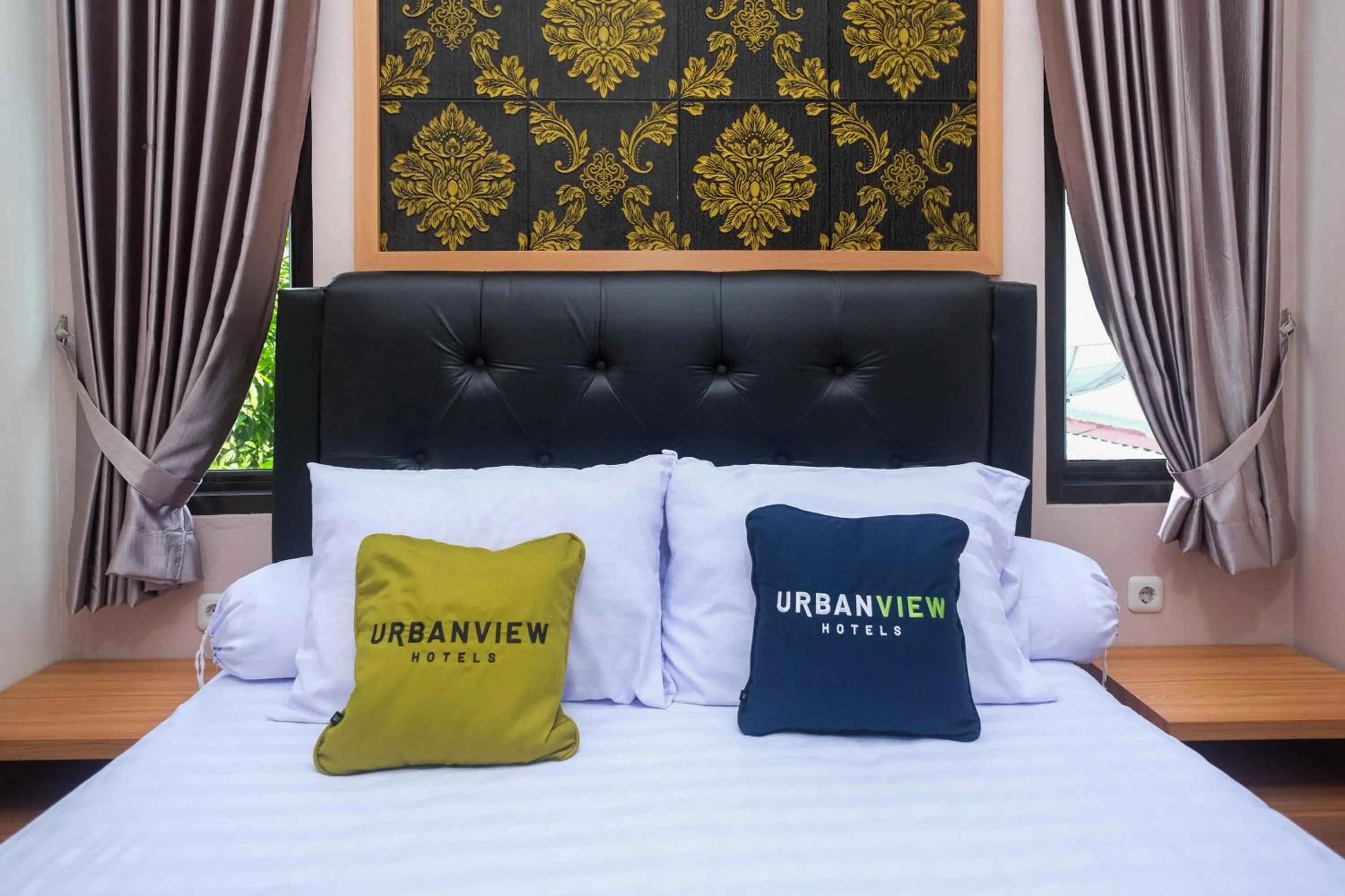 Bedroom, Bed in Urbanview Grand Lotus Hotel by RedDoorz