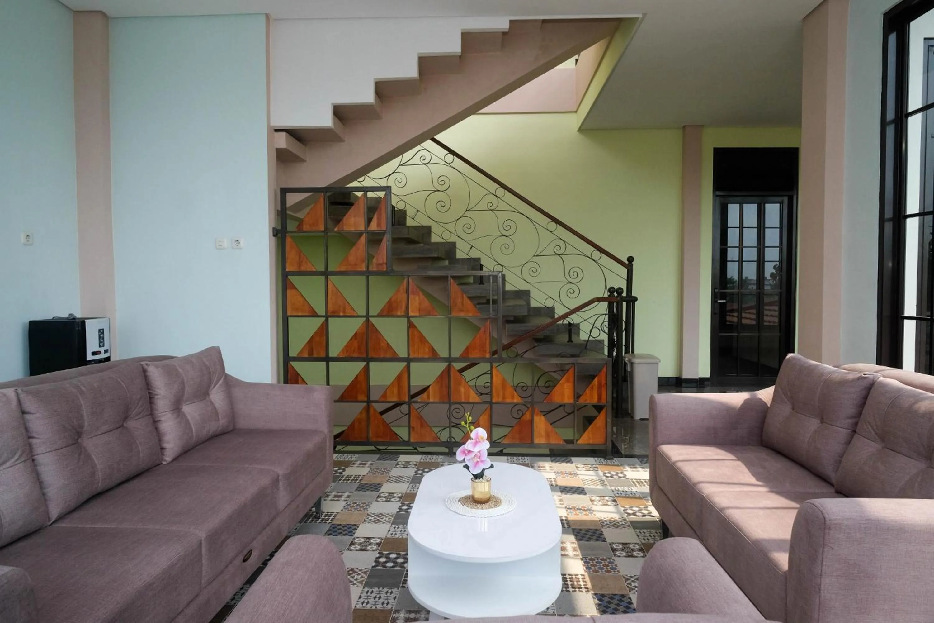 Seating area in Urbanview Grand Lotus Hotel by RedDoorz