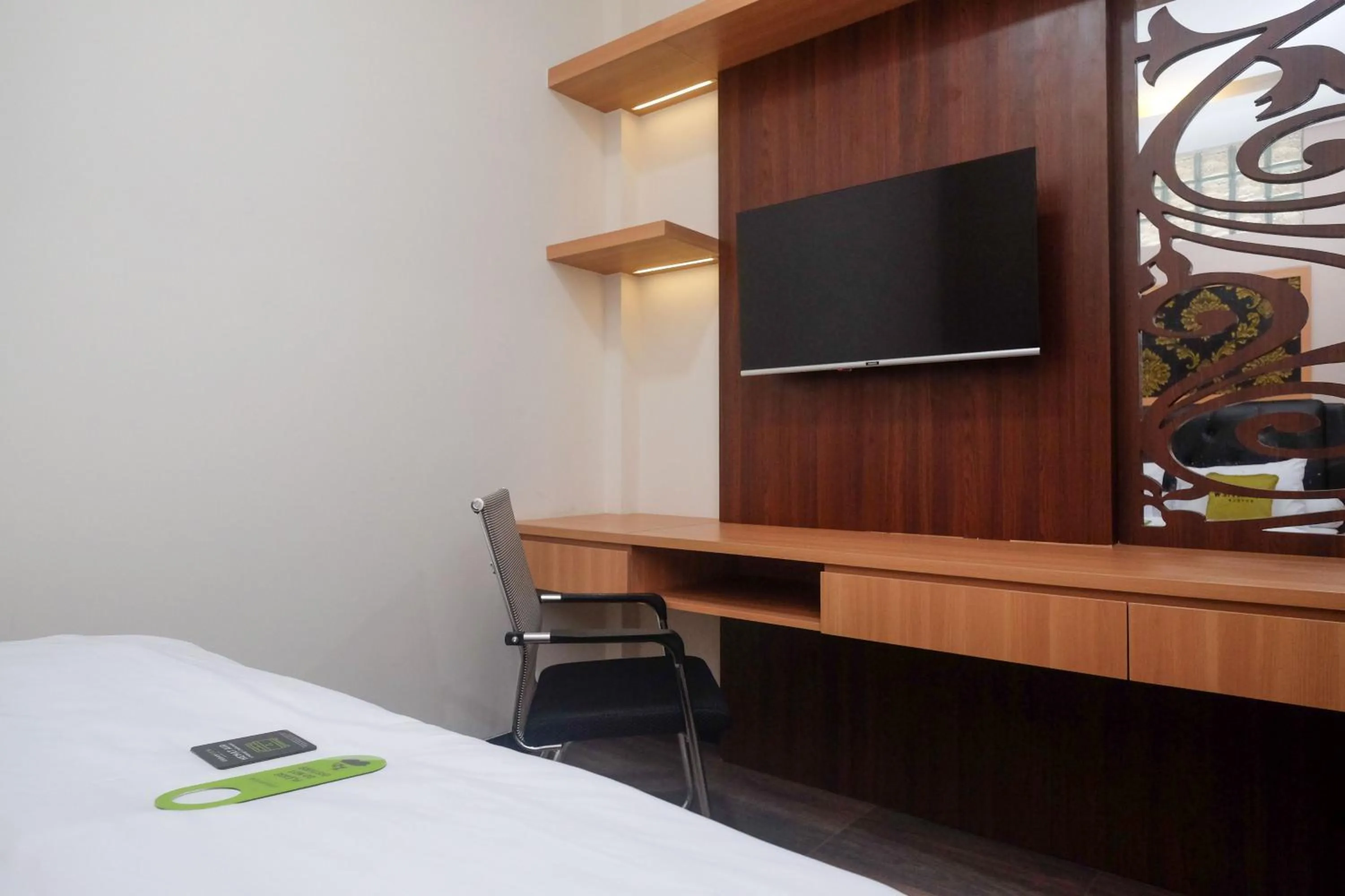 Bedroom, Bed in Urbanview Grand Lotus Hotel by RedDoorz