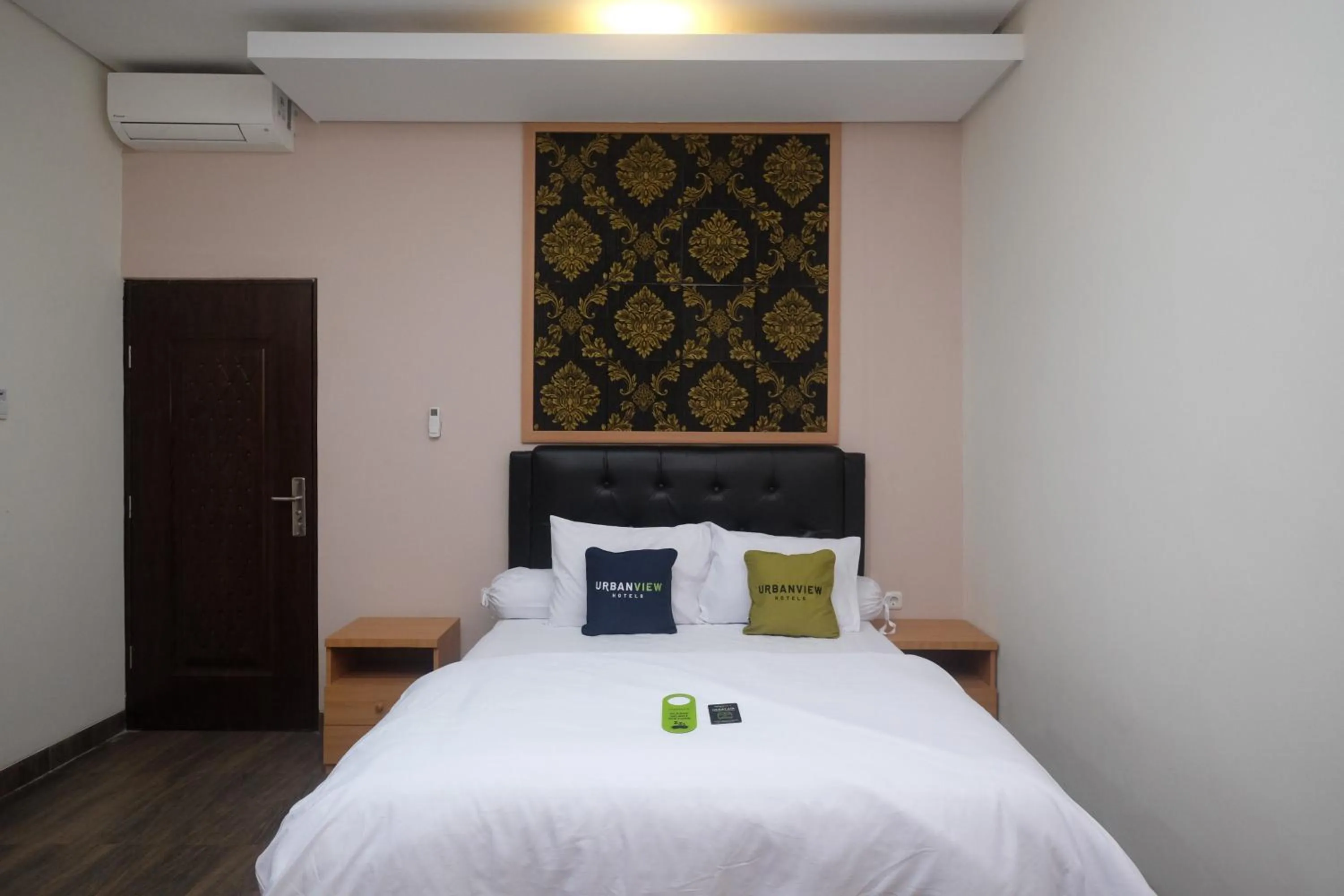 Bedroom, Bed in Urbanview Grand Lotus Hotel by RedDoorz