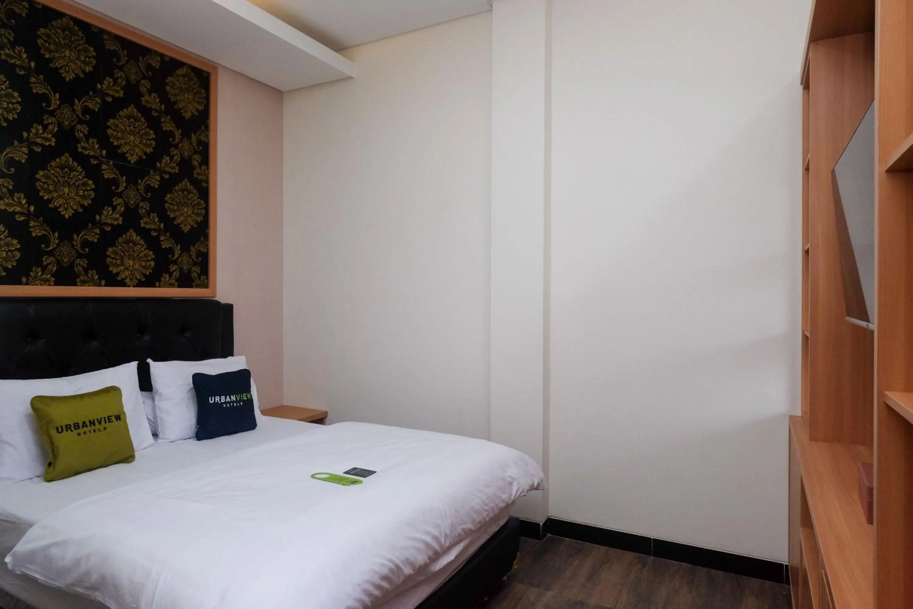 Bedroom, Bed in Urbanview Grand Lotus Hotel by RedDoorz
