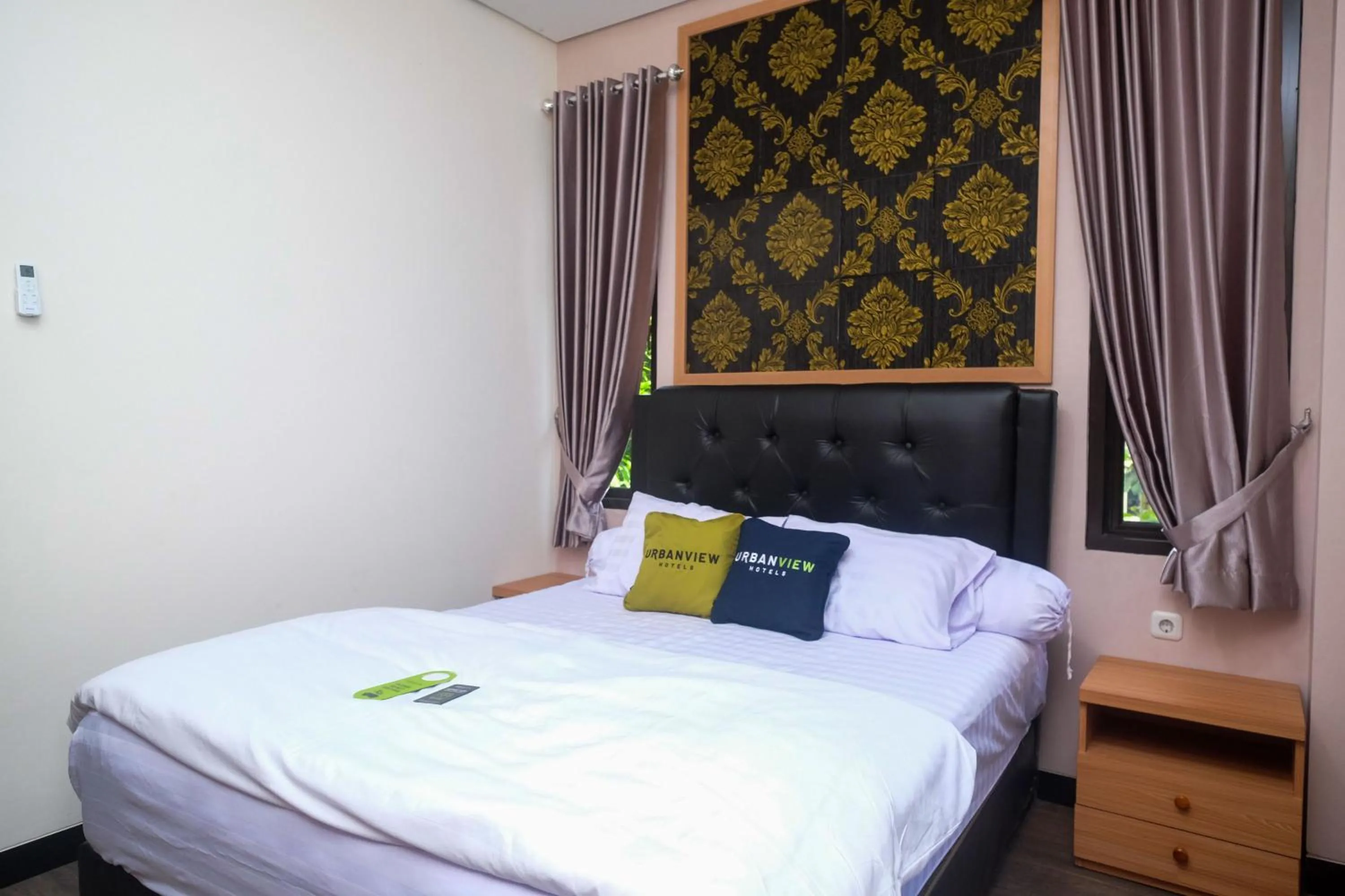 Bedroom, Bed in Urbanview Grand Lotus Hotel by RedDoorz