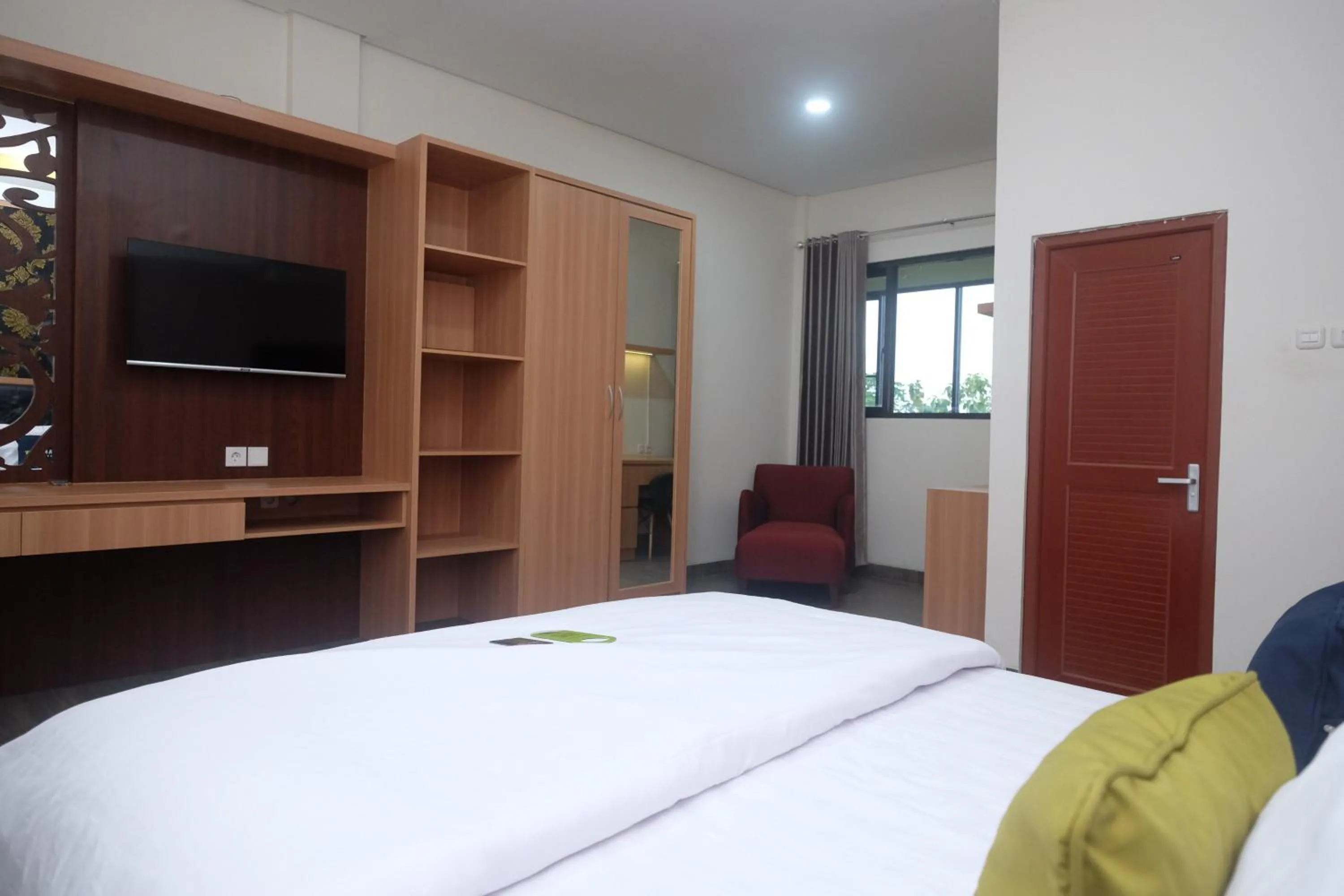 Bedroom, Bed in Urbanview Grand Lotus Hotel by RedDoorz
