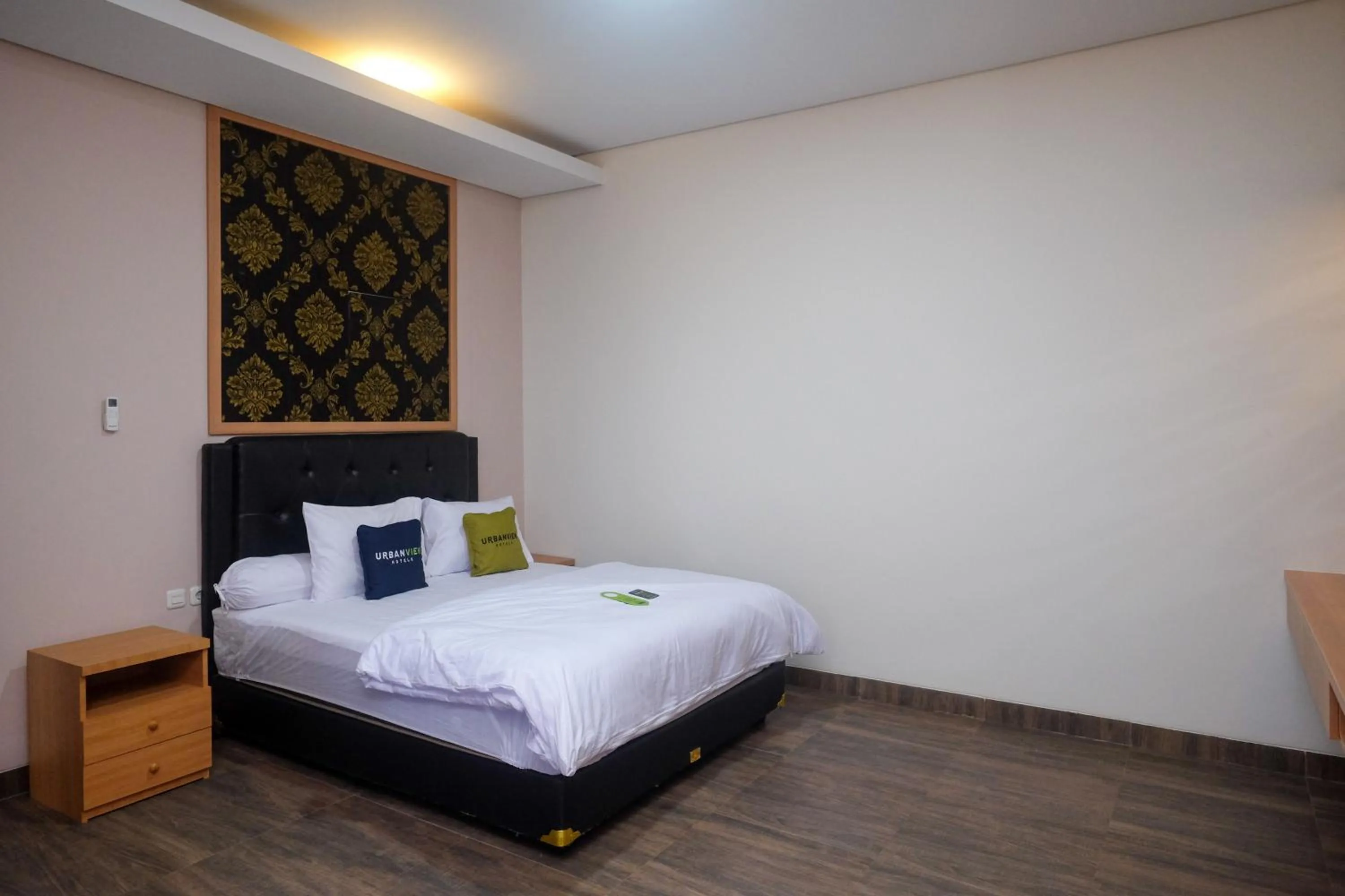 Bedroom, Bed in Urbanview Grand Lotus Hotel by RedDoorz