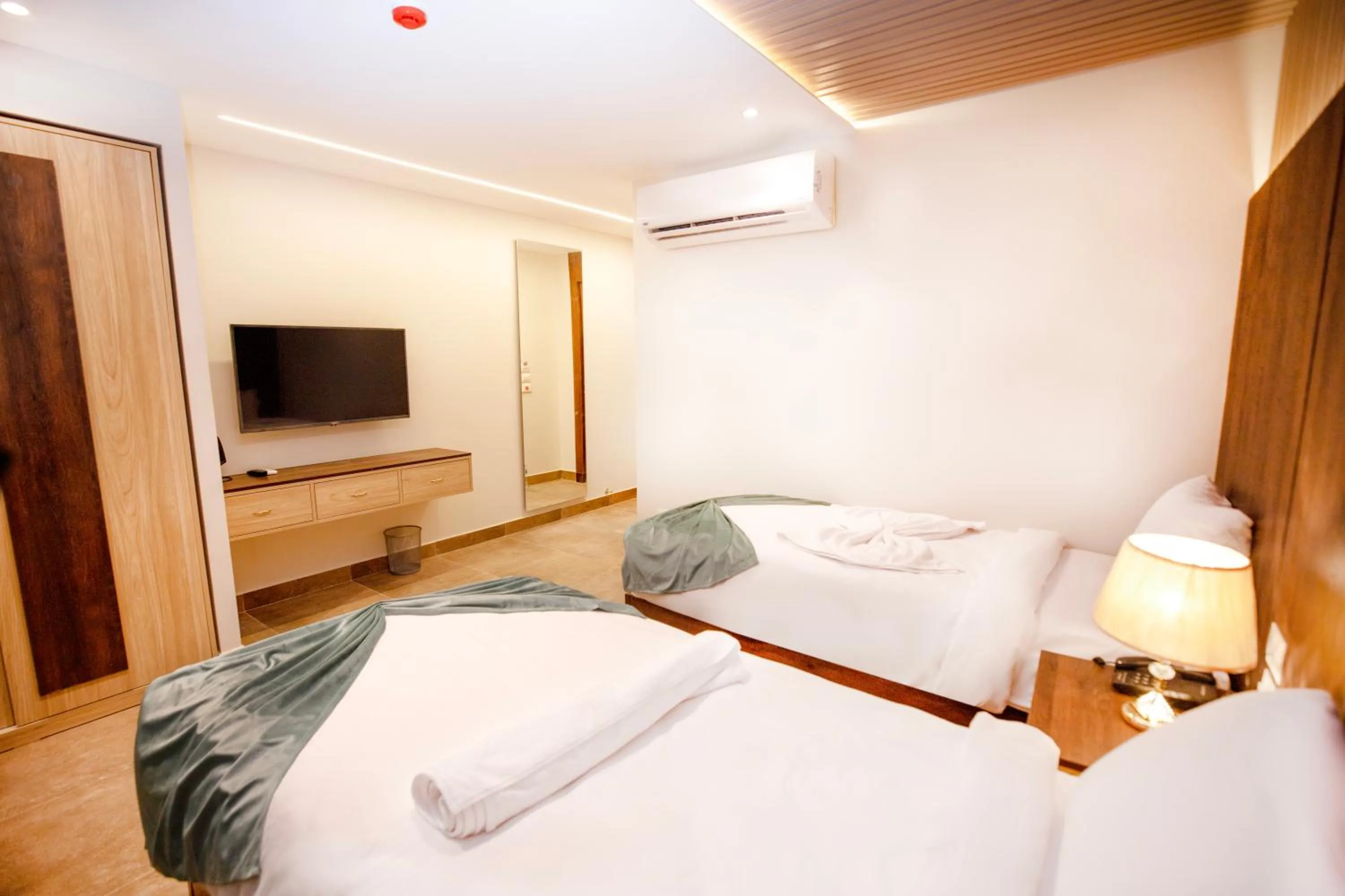 Communal lounge/ TV room, Bed in Blue Pyramids Eyes Hotel