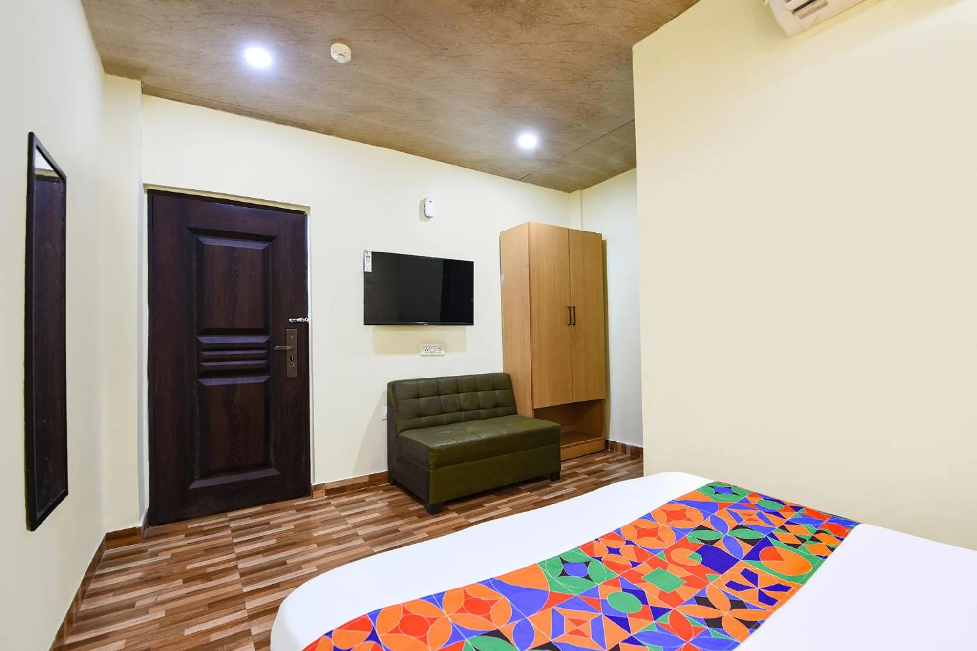 Bed in FabHotel Royal Reena Residency