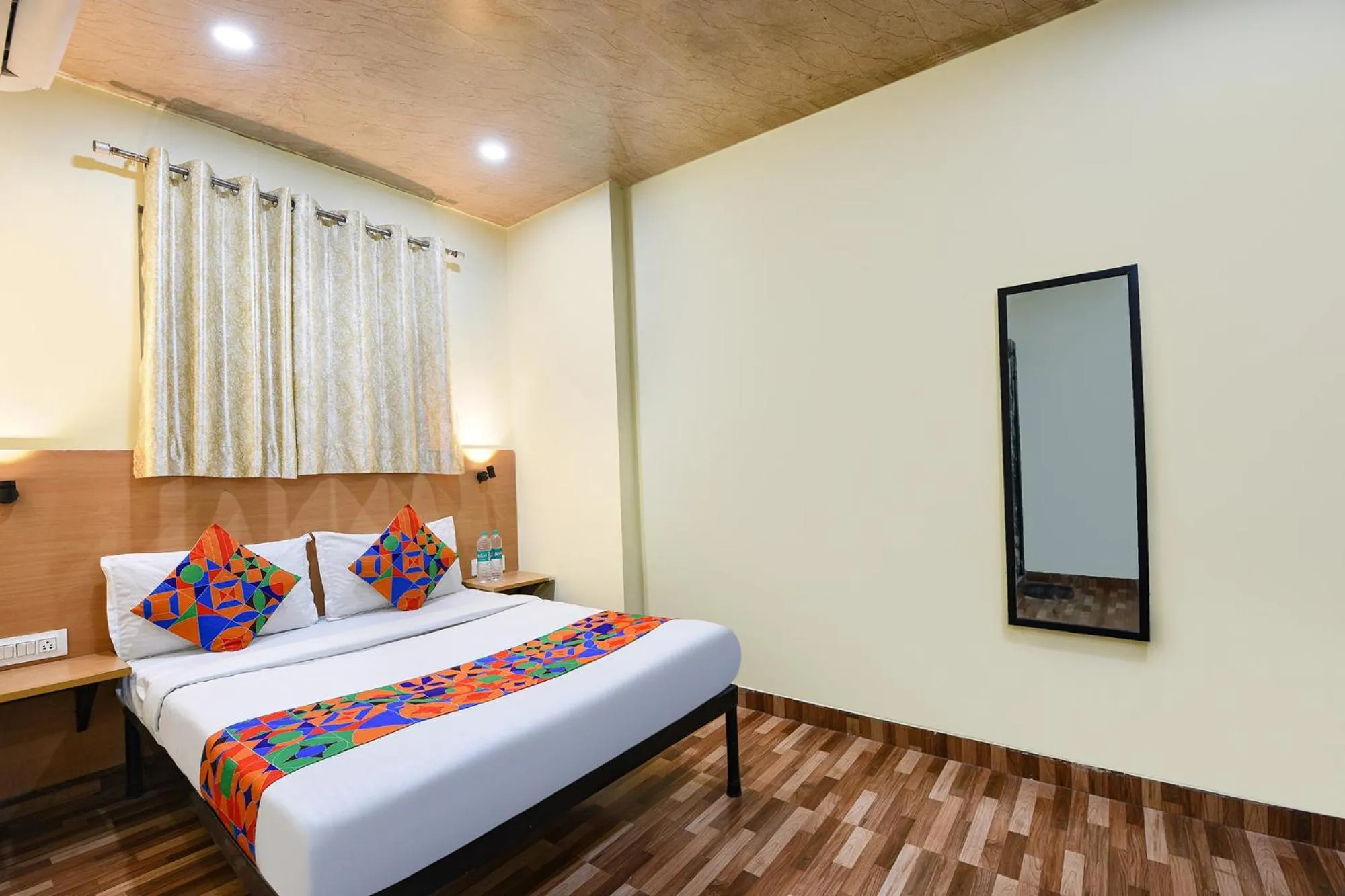 Bed in FabHotel Royal Reena Residency