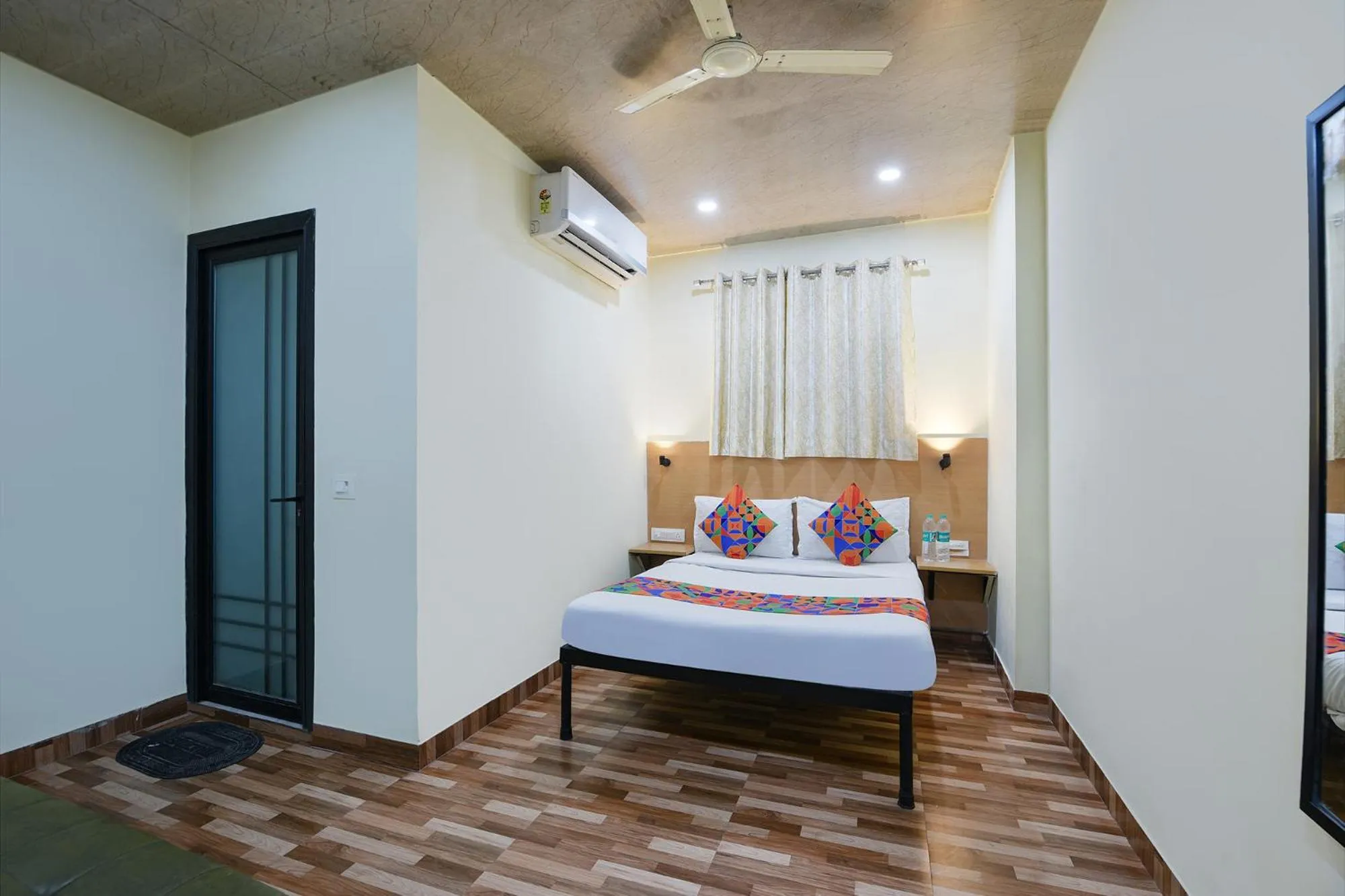 Bed in FabHotel Royal Reena Residency