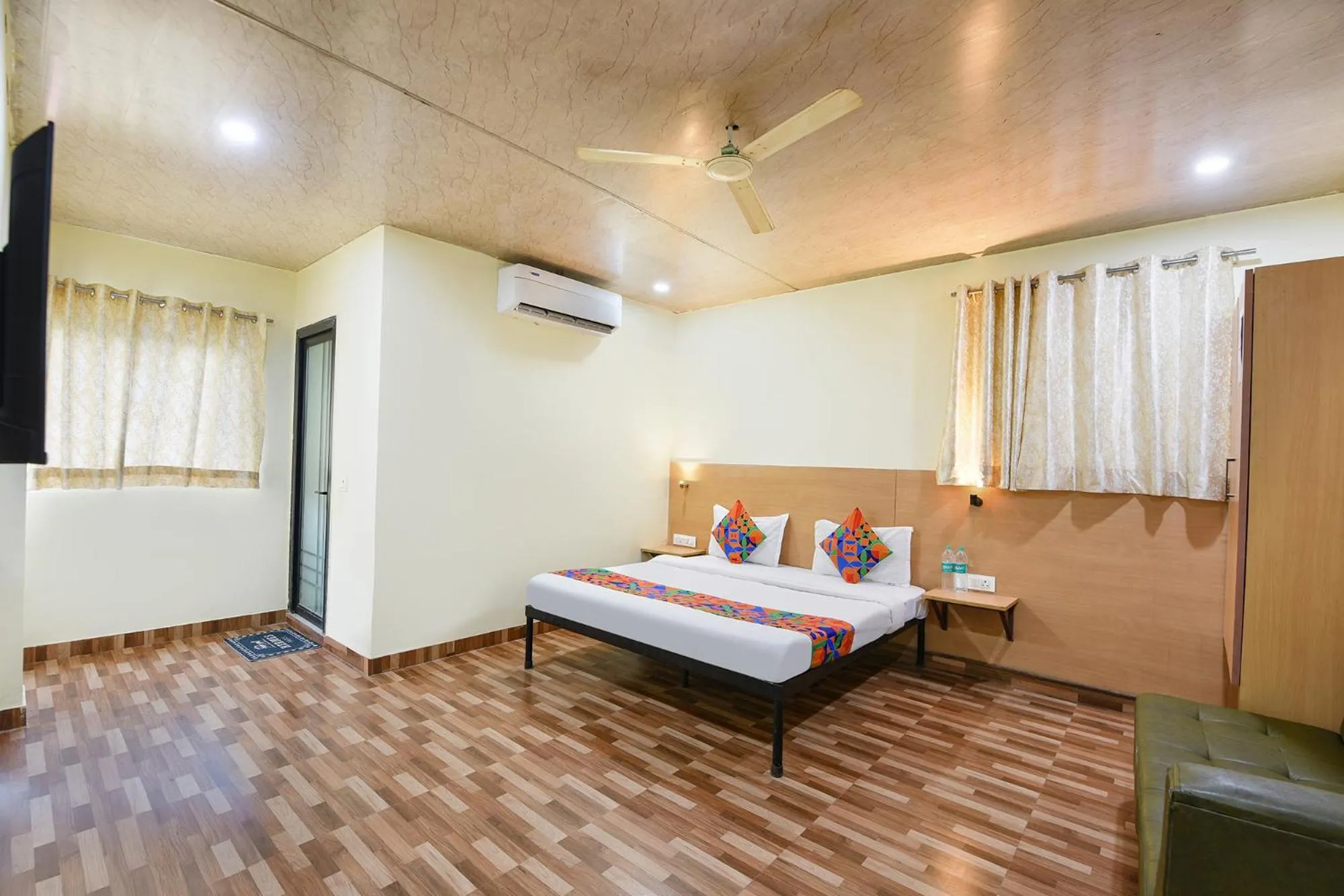 Bed in FabHotel Royal Reena Residency