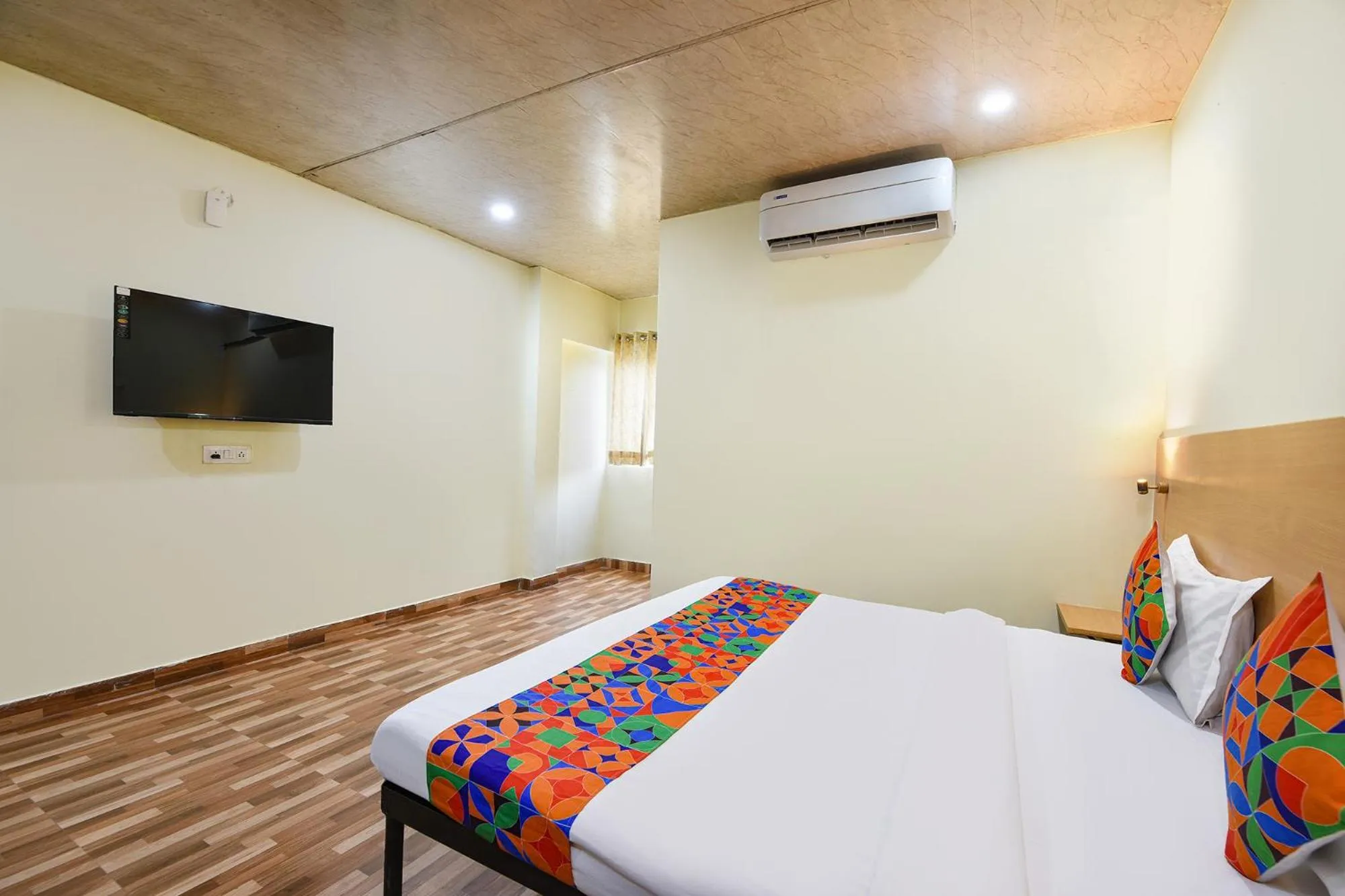 Bed in FabHotel Royal Reena Residency