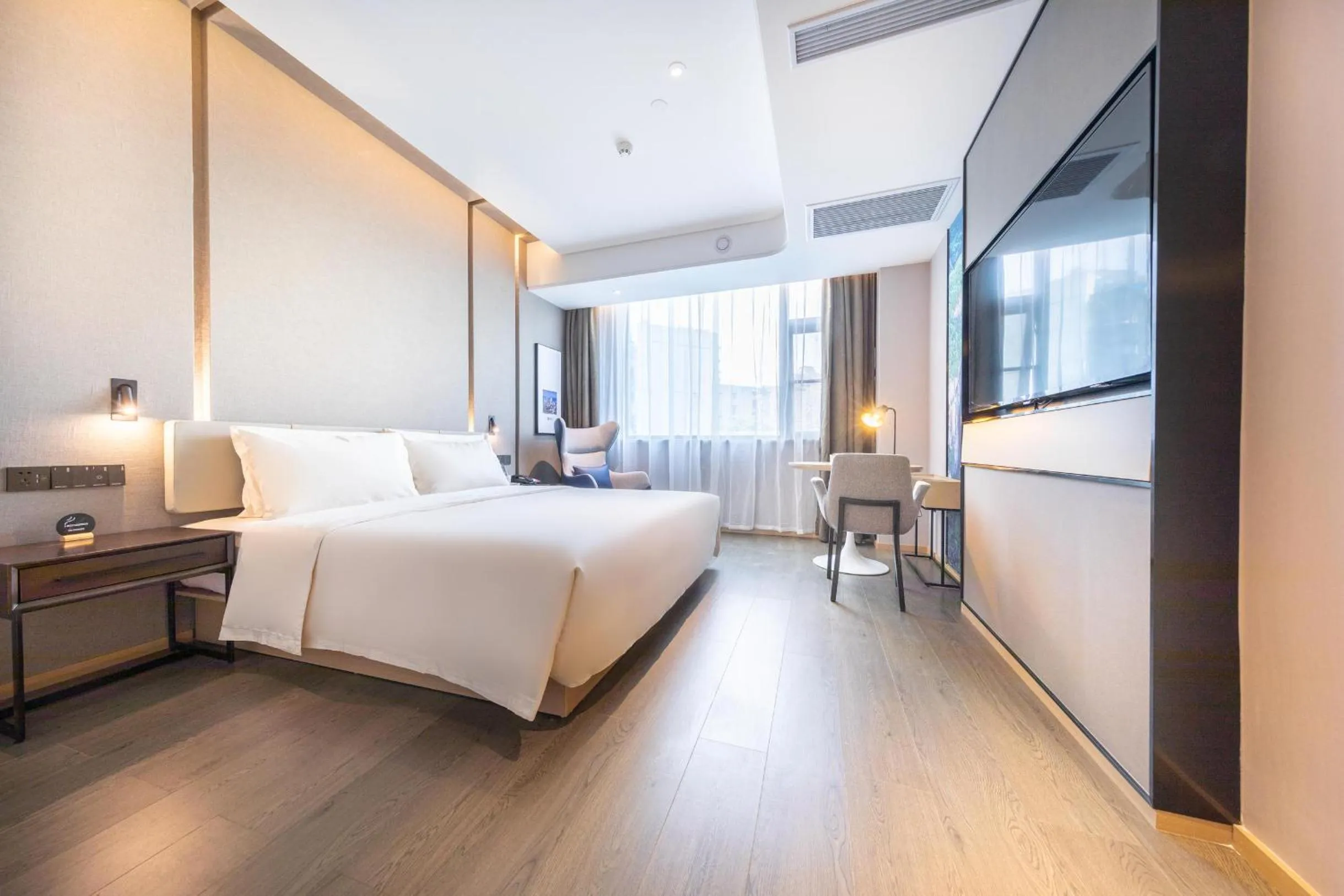 Bed in Atour Hotel Chongqing Guanyinqiao Flower Garden