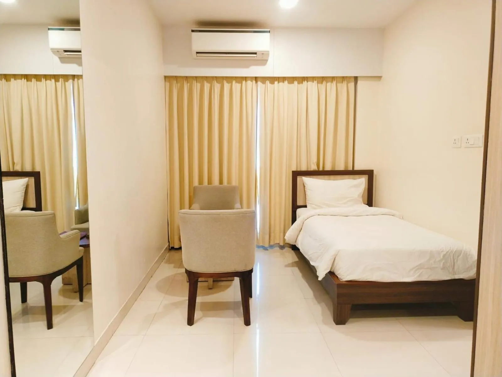Bed in Sambhabana Hotel & Suites