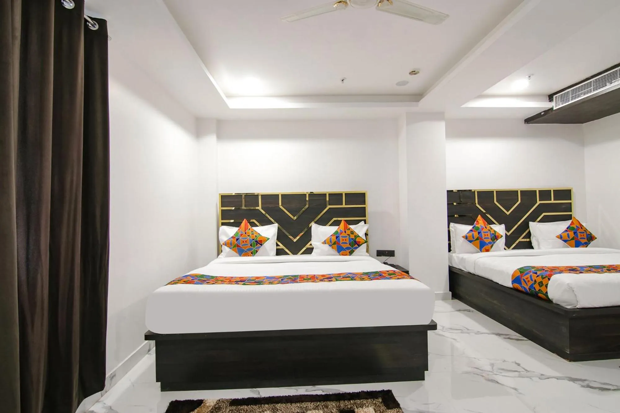 Bed in FabHotel Sky Suites Karkardooma