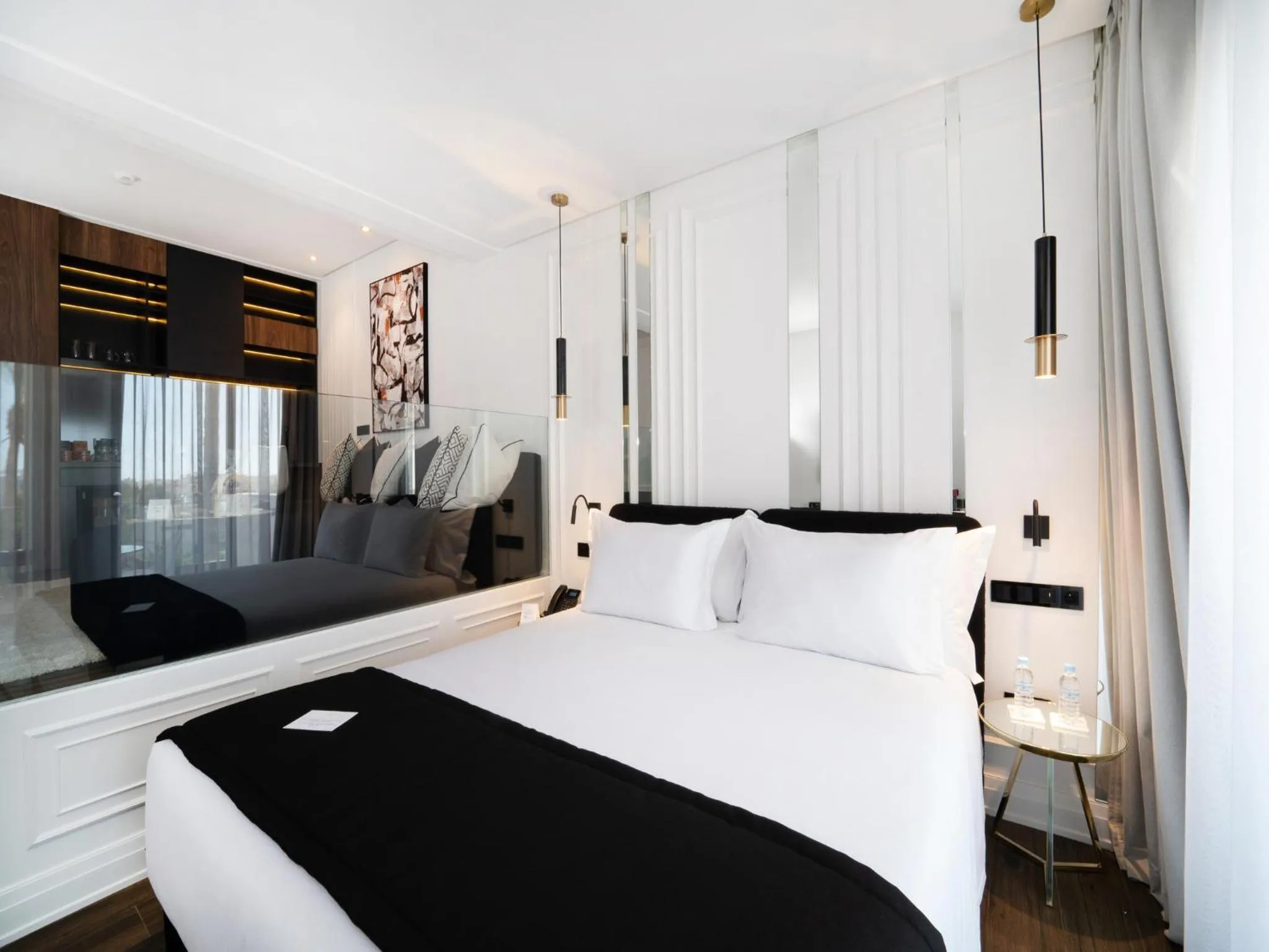 Bed in Petit Palace Suites Hotel