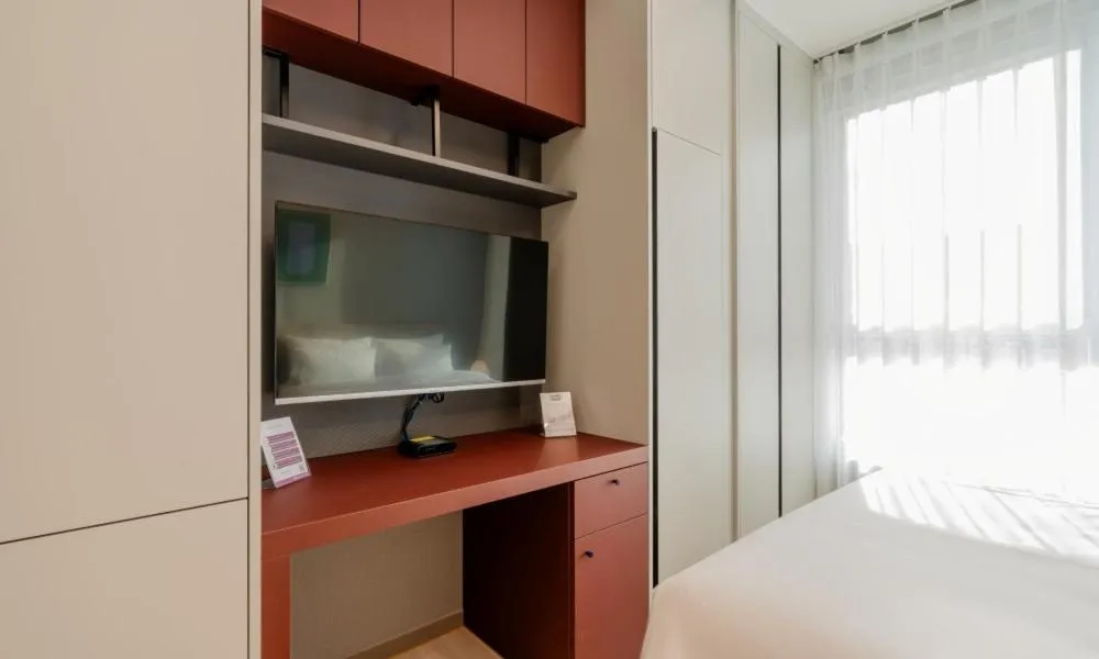 Bed in Radiant Nampo Hotel