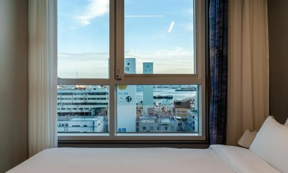 Bed in Radiant Nampo Hotel