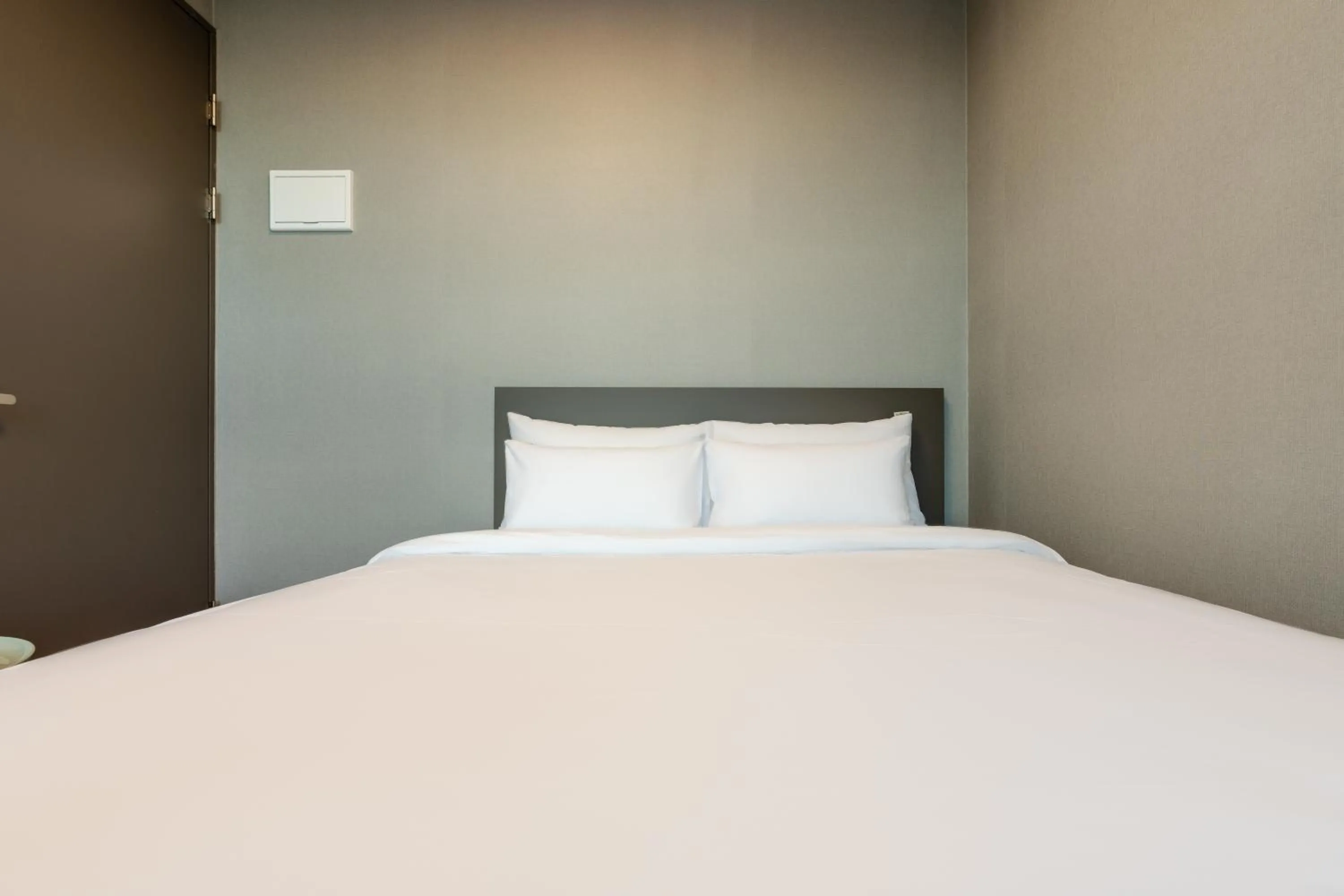 Bed in Radiant Nampo Hotel