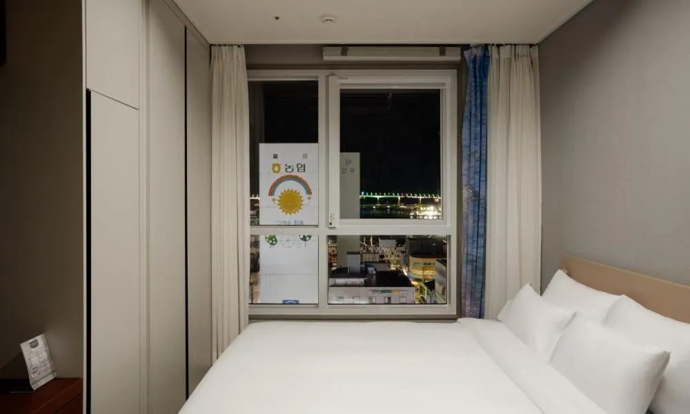 Bed in Radiant Nampo Hotel