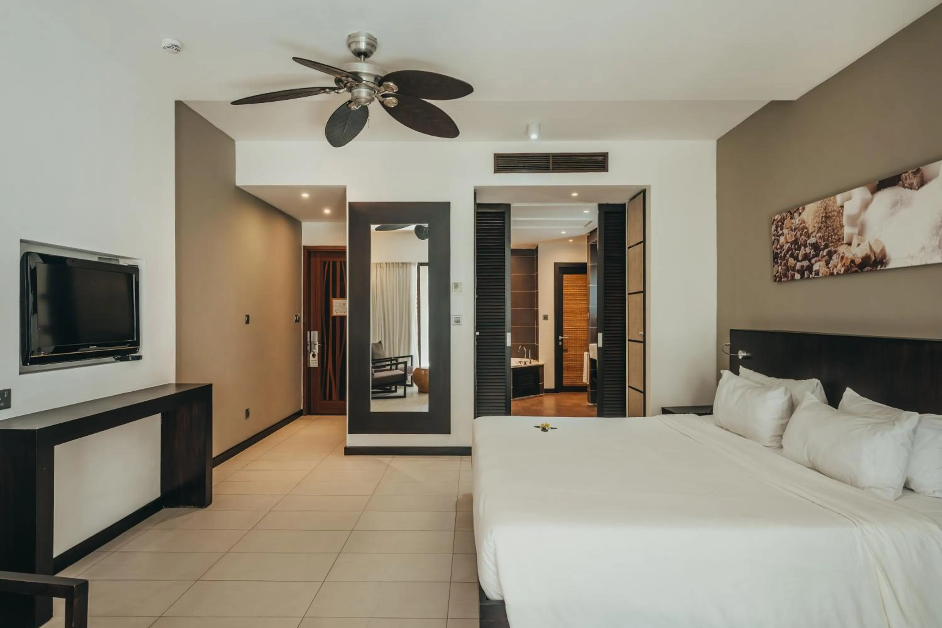 Bed in Crystals Beach Resort Belle Mare, a member of Radisson Individuals