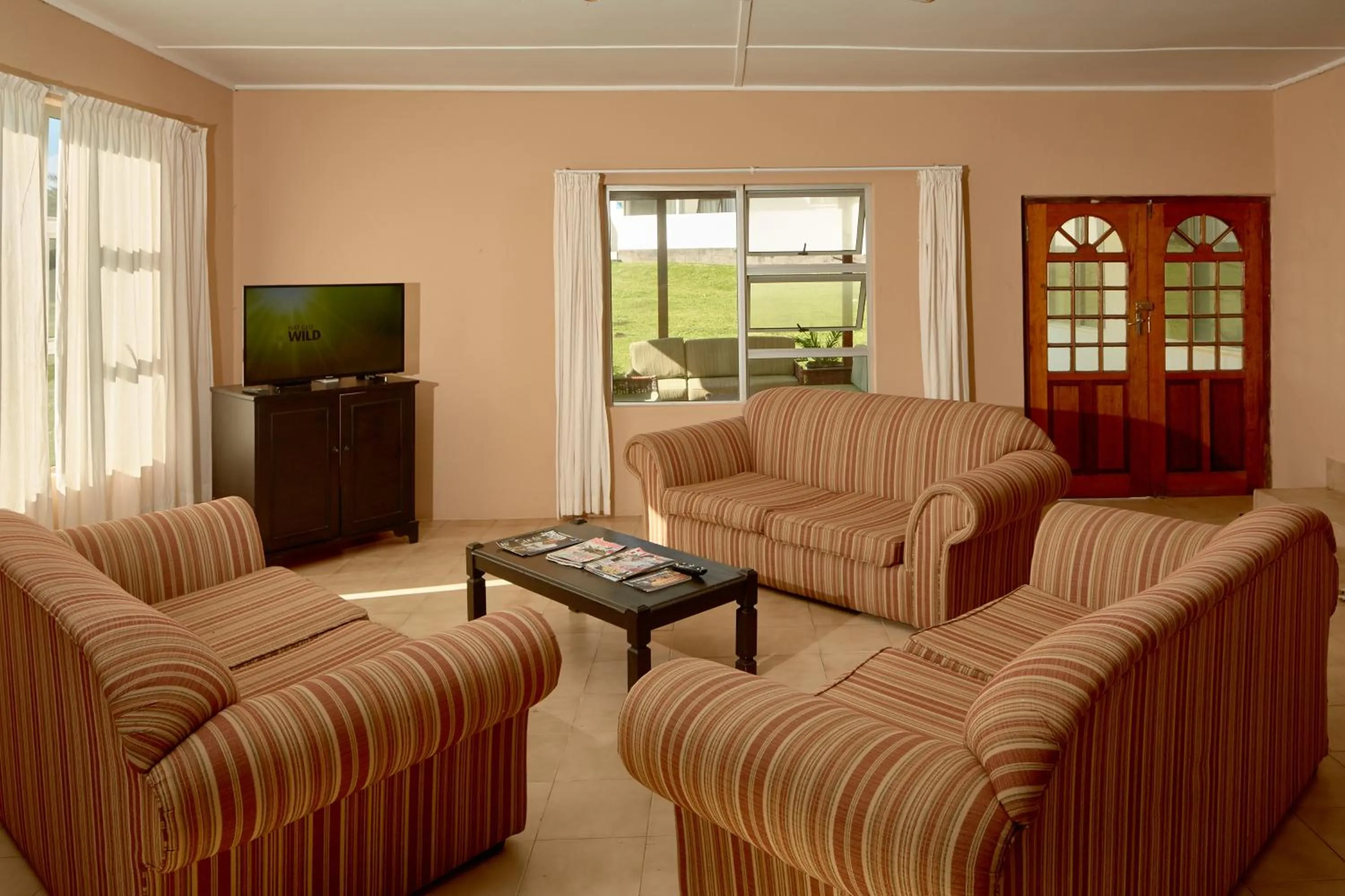 Communal lounge/ TV room in First Group Hole in the Wall