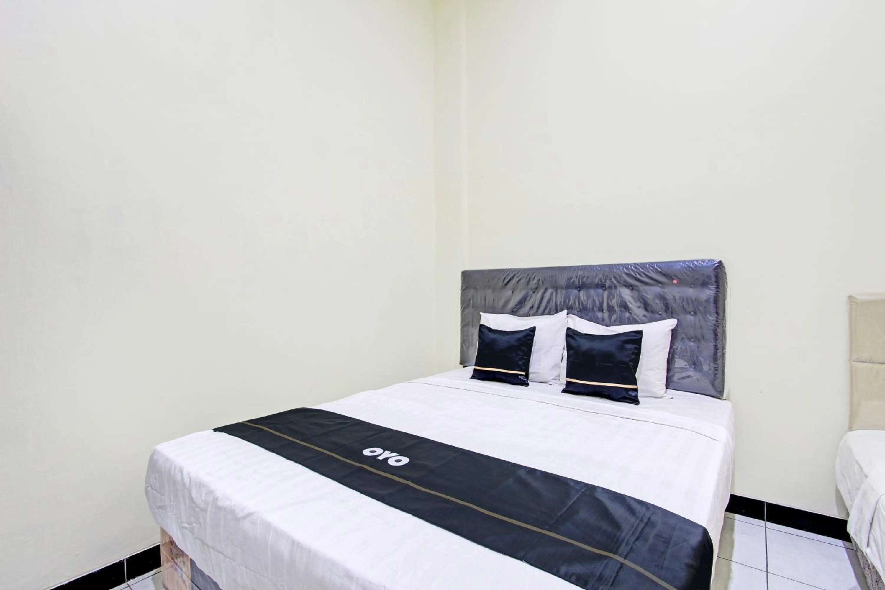 Bedroom in Super OYO Capital O 93204 Hotel Mulia Dua Syariah