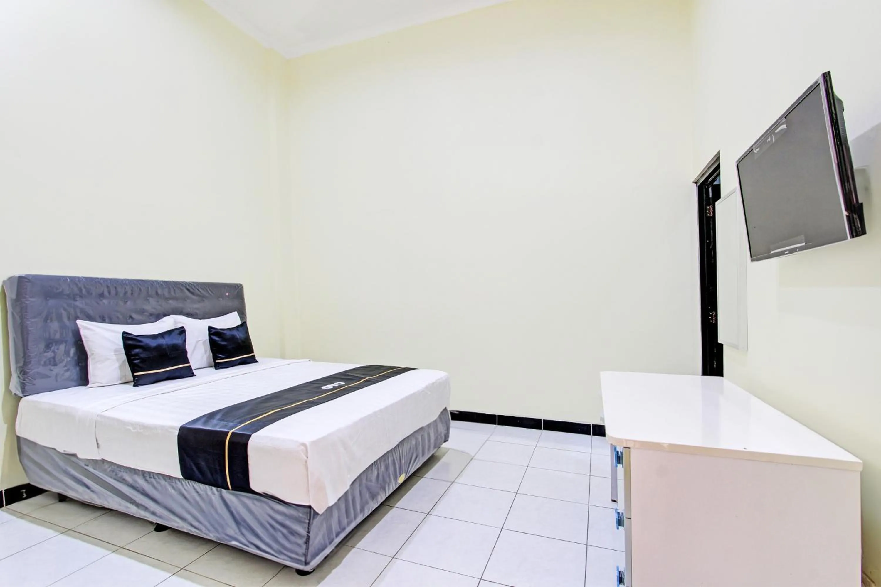 Bedroom in Super OYO Capital O 93204 Hotel Mulia Dua Syariah