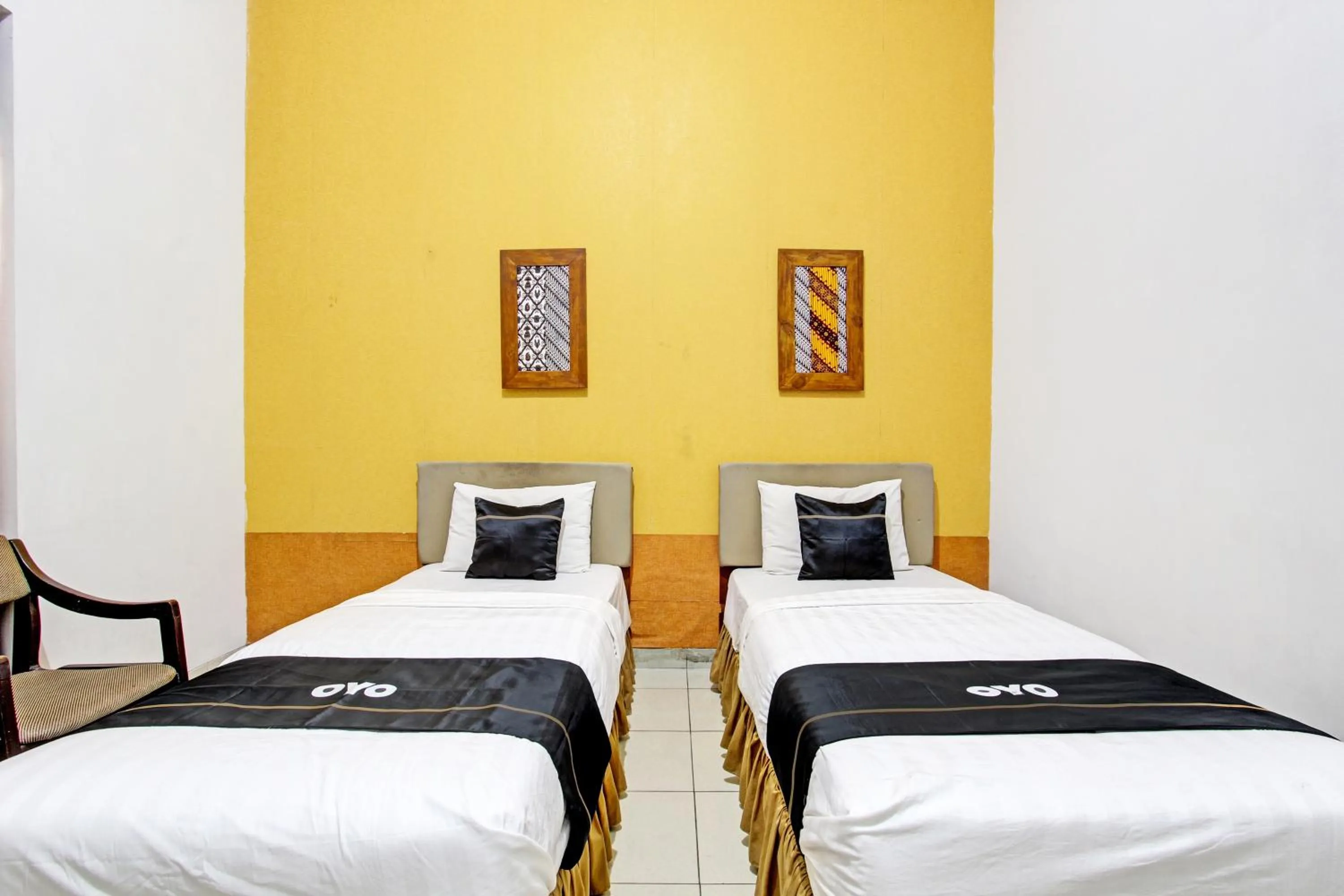 Bedroom in Super OYO Capital O 93240 Candra Dewi Hotel