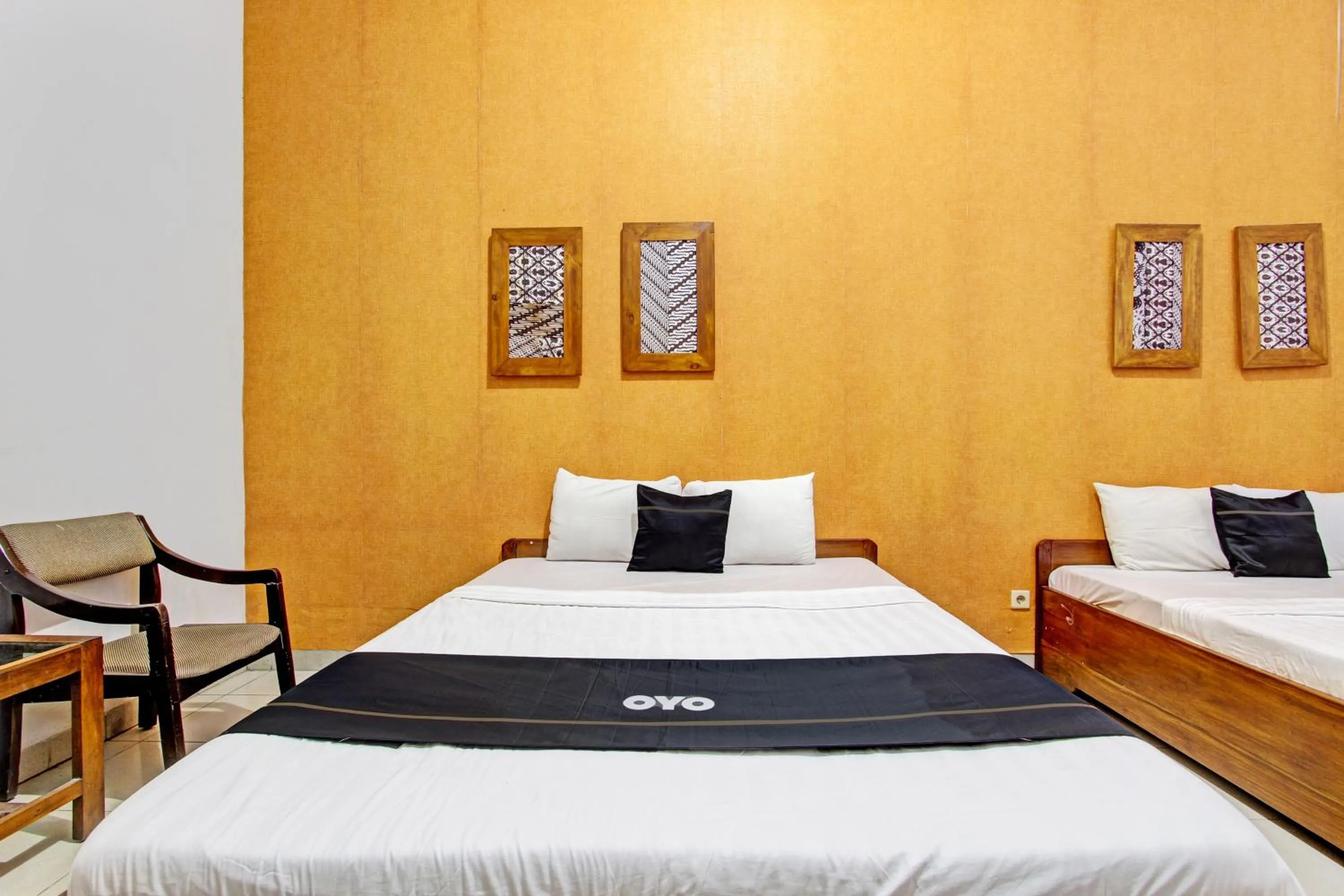 Bedroom in Super OYO Capital O 93240 Candra Dewi Hotel