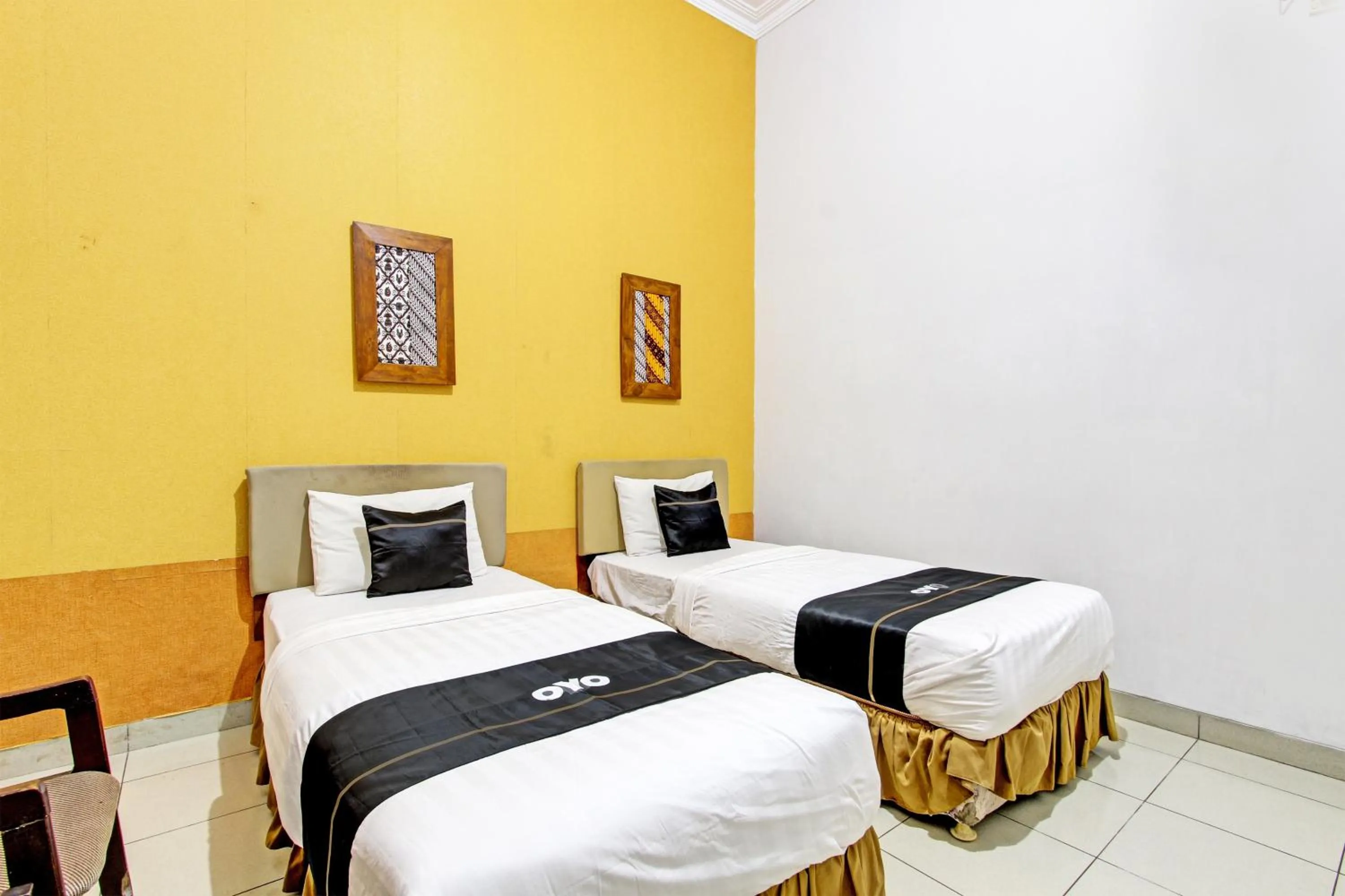 Bedroom in Super OYO Capital O 93240 Candra Dewi Hotel