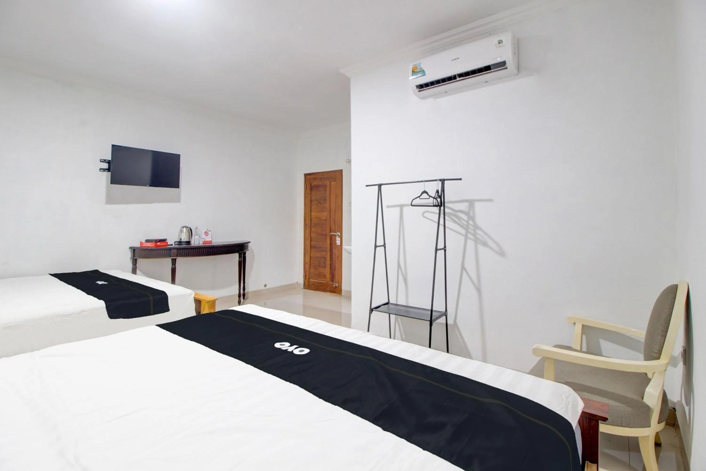 Bedroom in Capital O 93266 Palmier Hotel