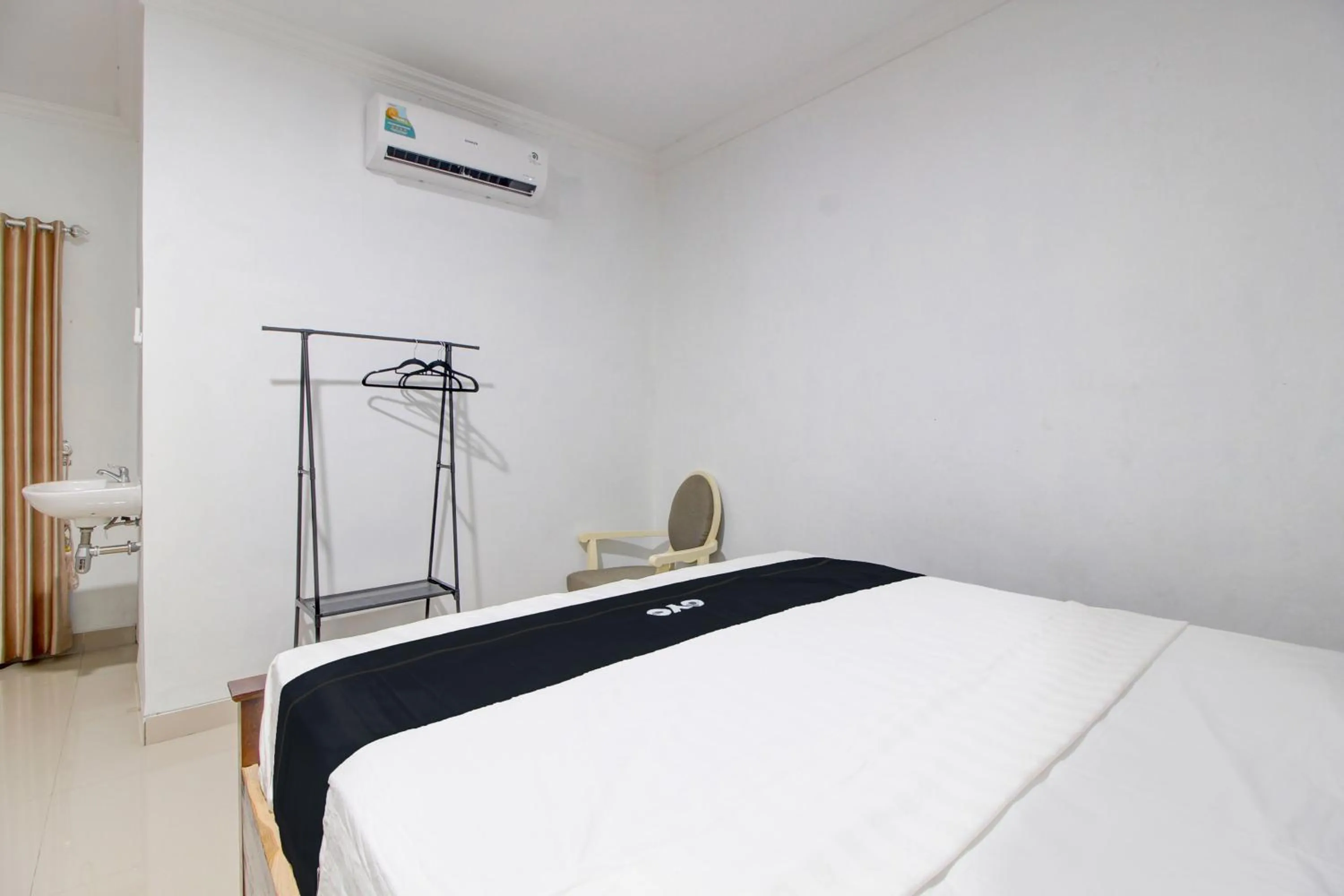 Bedroom in Capital O 93266 Palmier Hotel