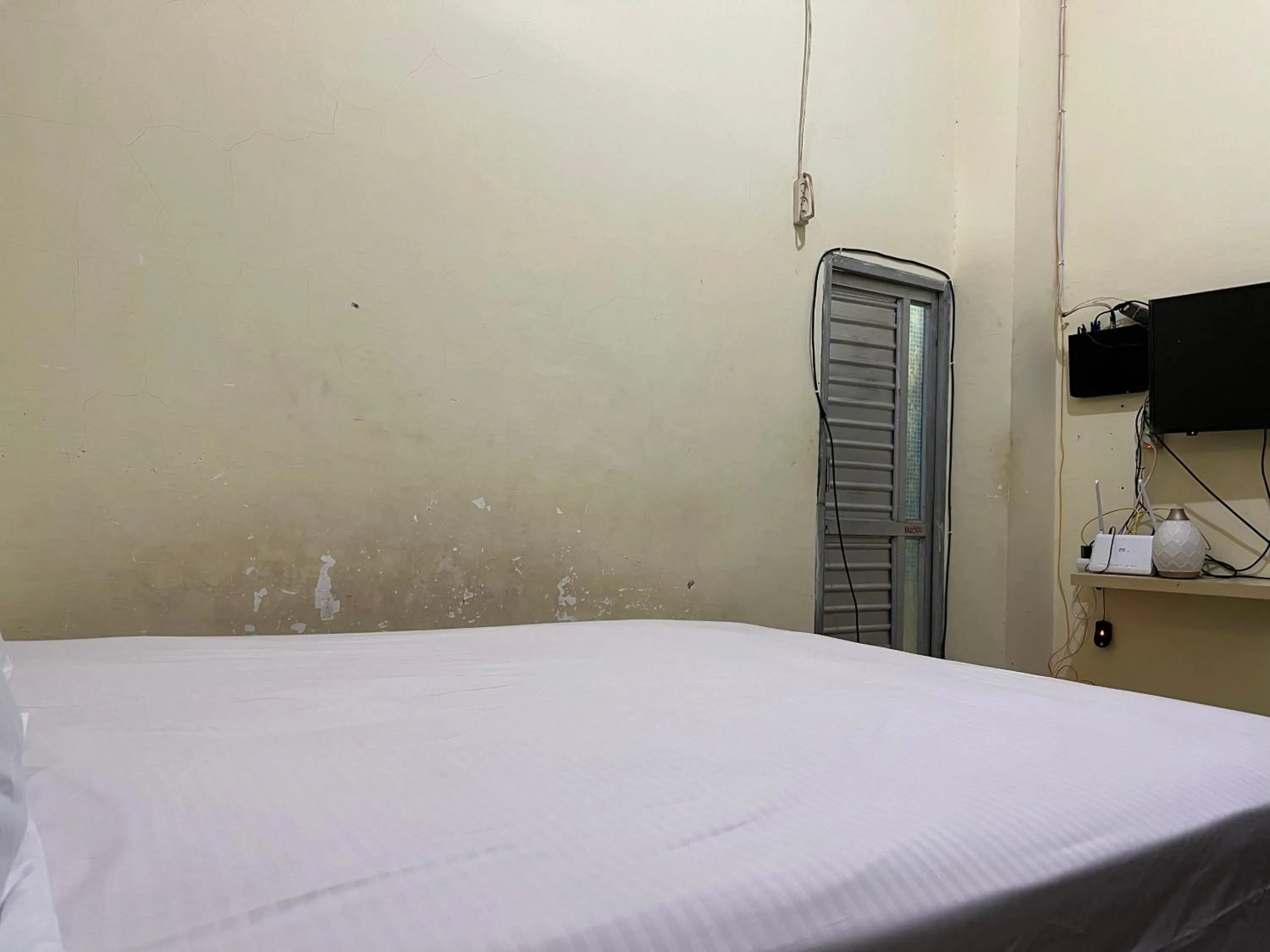 Bedroom, Bed in Hotel O Mely Homestay